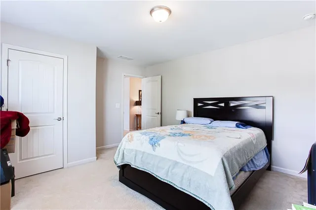 a bedroom with a bed and a closet