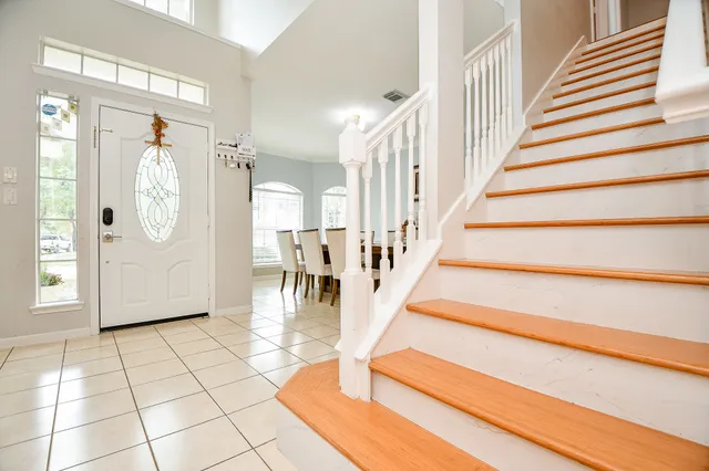 a view of entryway with wooden floor and chandelier