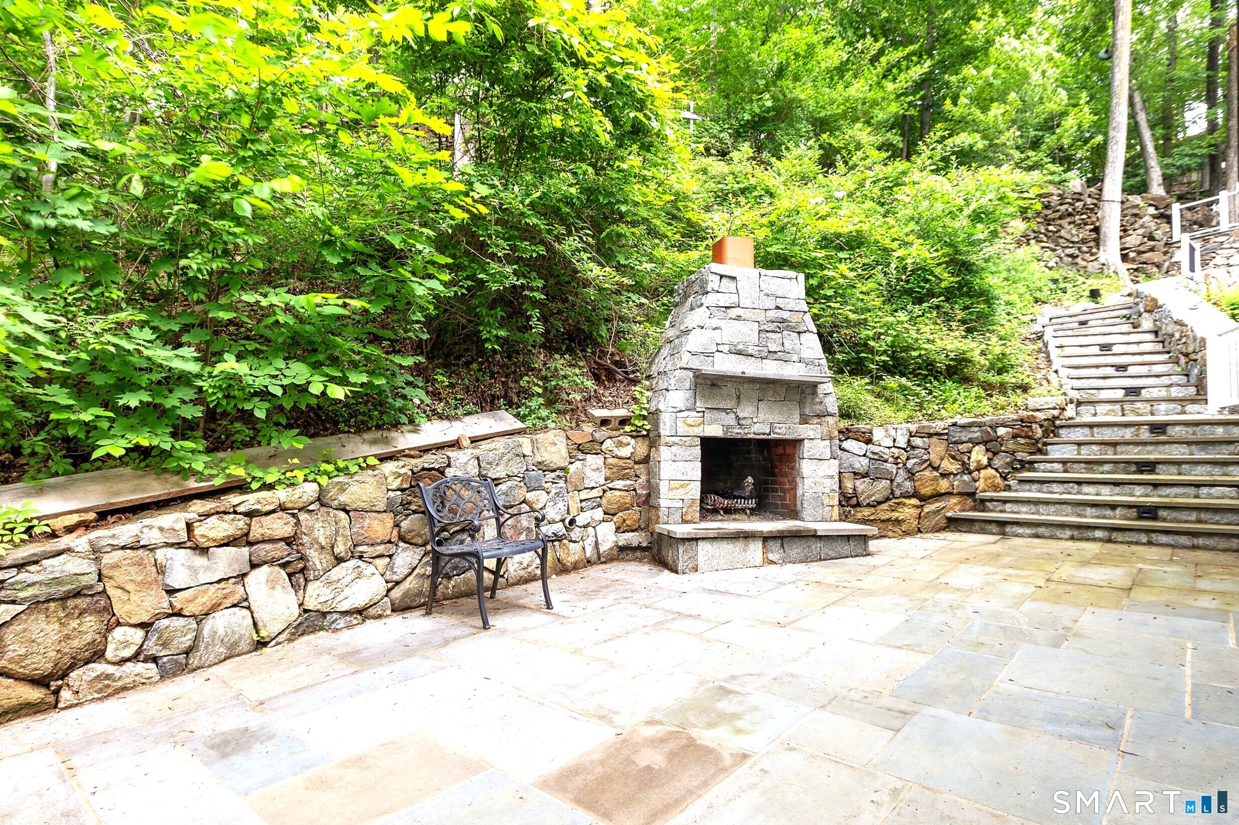 14 Bogus Hill Road New Fairfield, CT 06812 - Photo 6 of 27 Side patio with outdoor fireplace