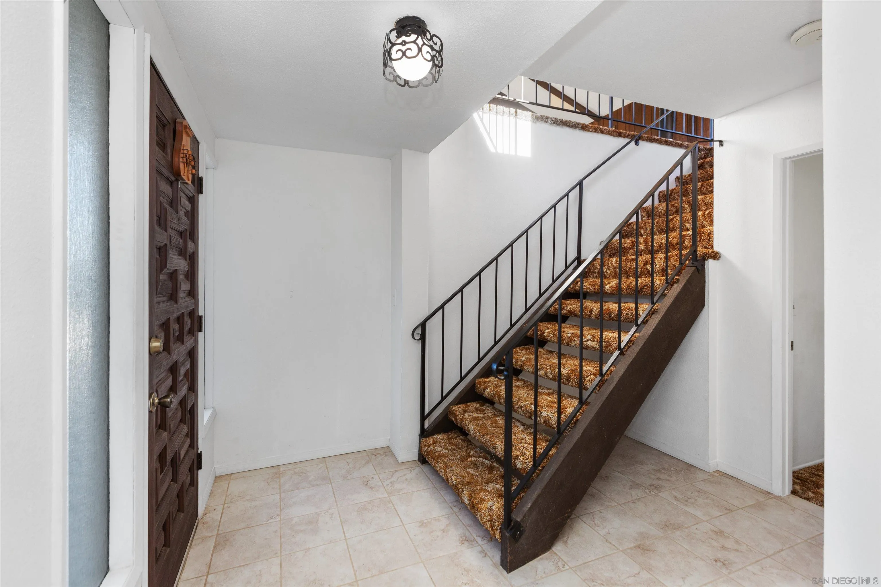 14537 Range Park Place Poway, CA 92064 - Photo 11 of 46 a view of entryway with wooden floor and stairs