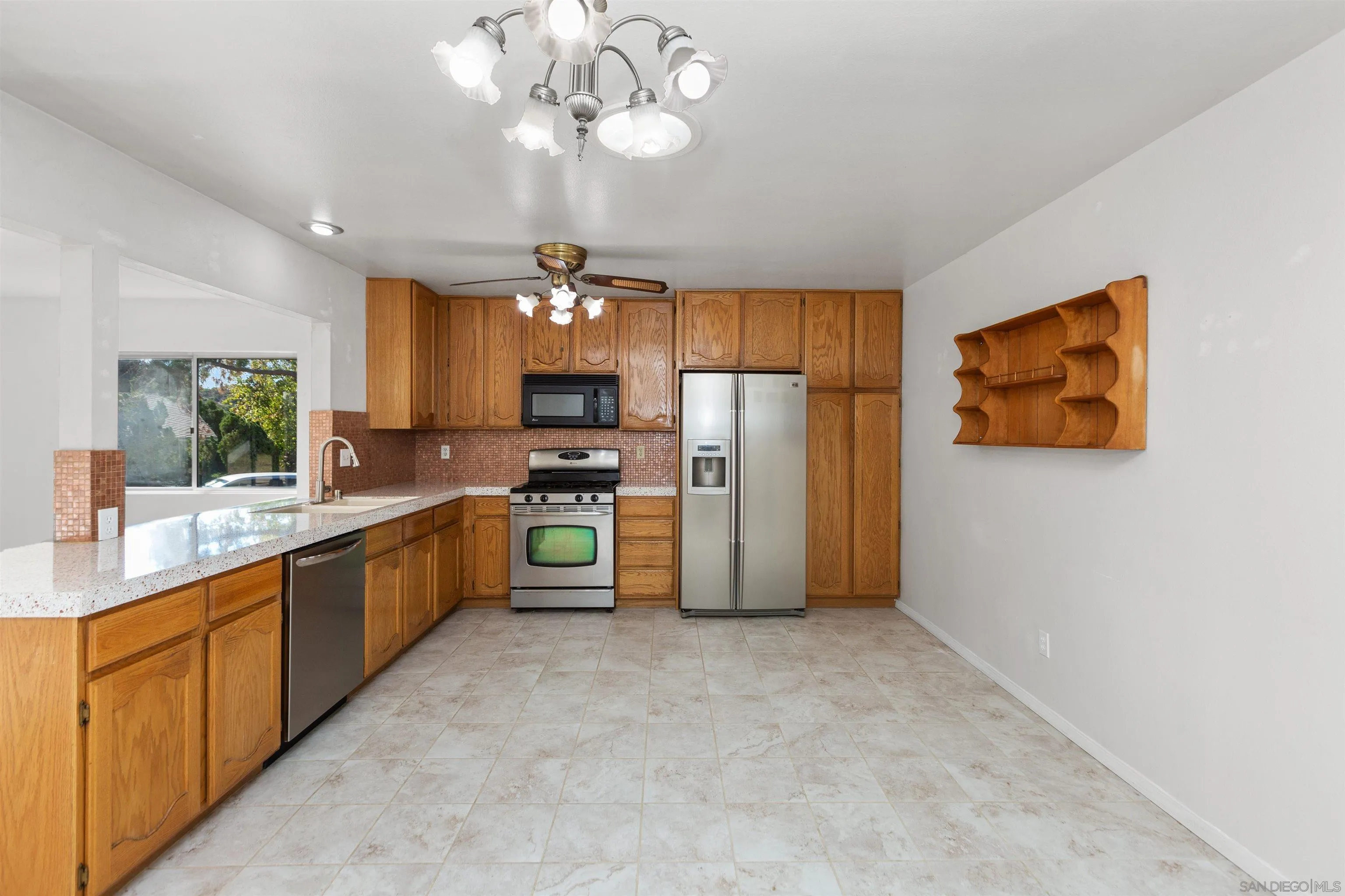 14537 Range Park Place Poway, CA 92064 - Photo 19 of 46 a kitchen with refrigerator and cabinets