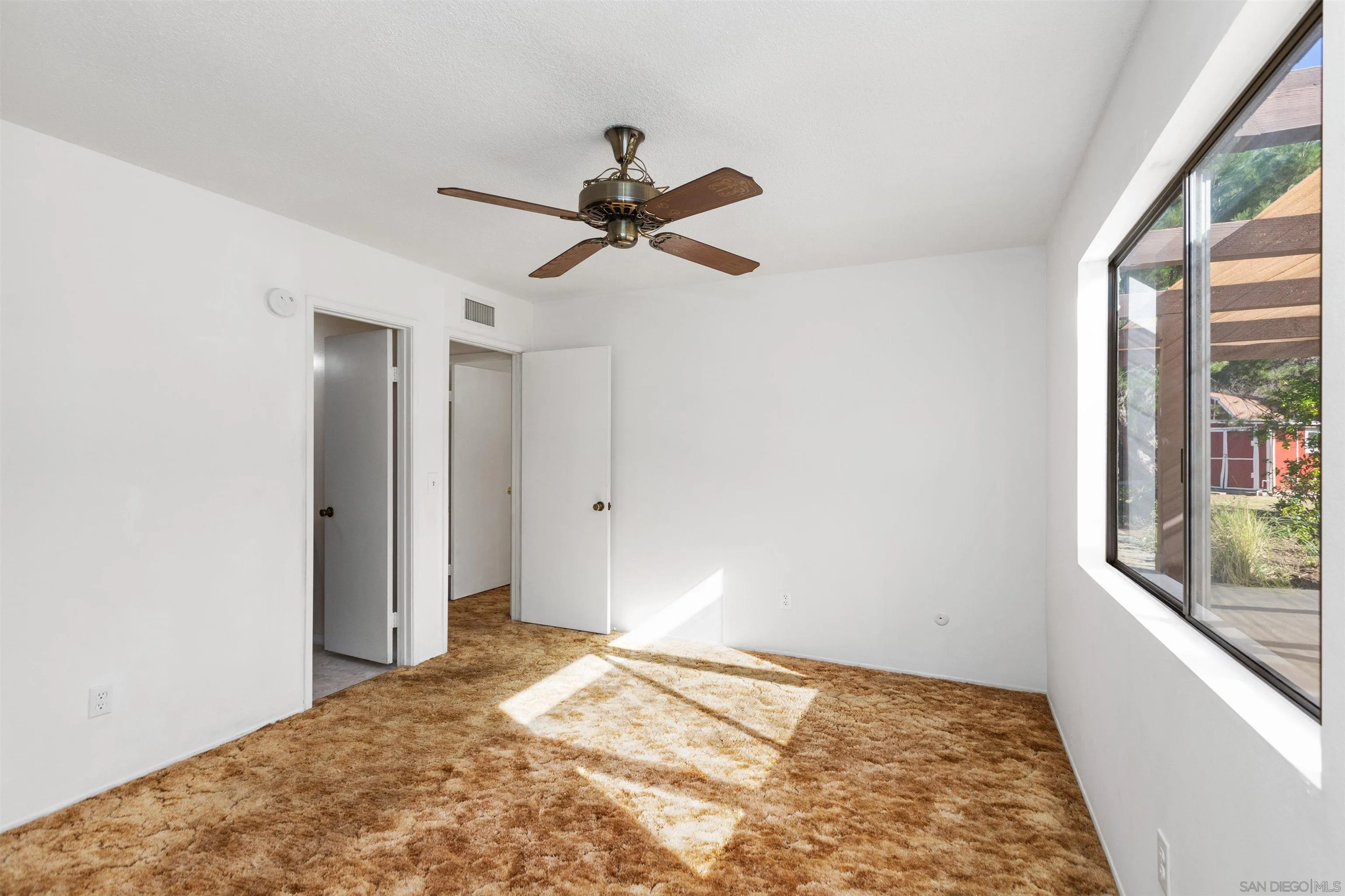 14537 Range Park Place Poway, CA 92064 - Photo 32 of 46 a view of a big room with wooden floor and a window