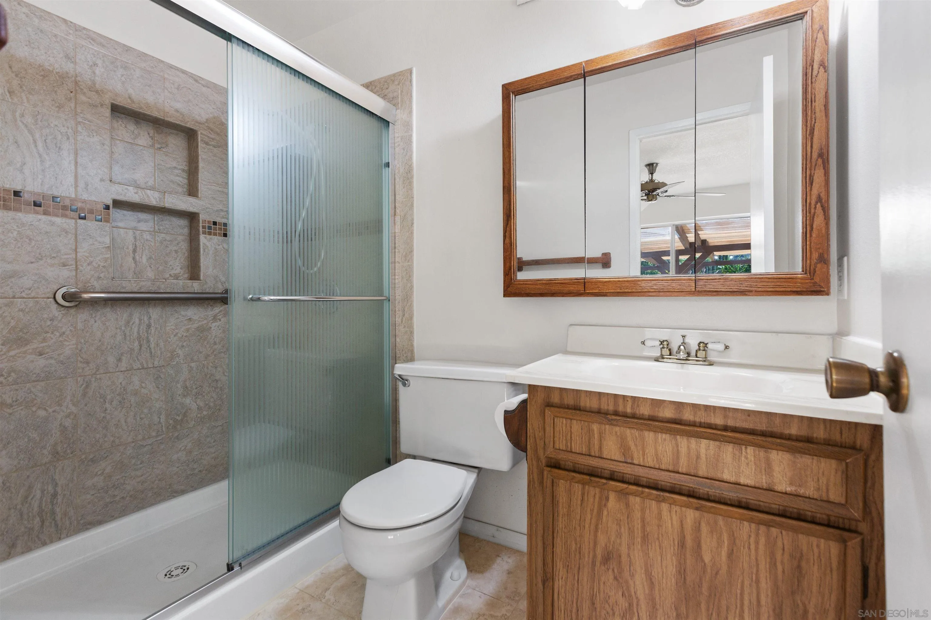 14537 Range Park Place Poway, CA 92064 - Photo 33 of 46 a bathroom with a sink a toilet and shower