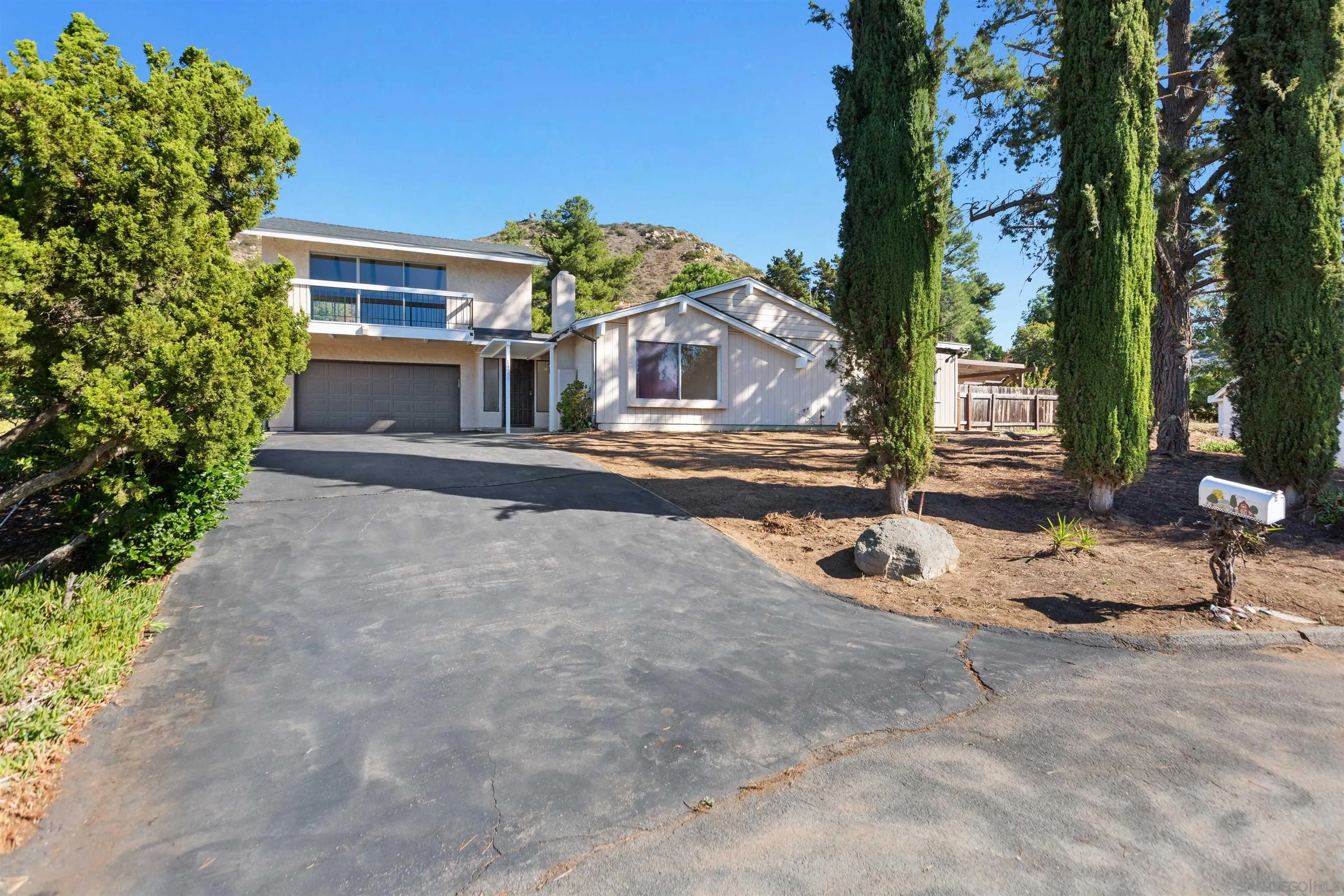 14537 Range Park Place Poway, CA 92064 - Photo 7 of 46 a front view of a house with a yard and garage