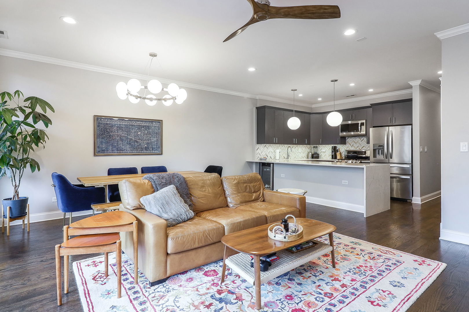 39 North Morgan Street, Unit 3 Chicago, IL 60607 - Photo 2 of 18 a living room with furniture and a dining table with kitchen view