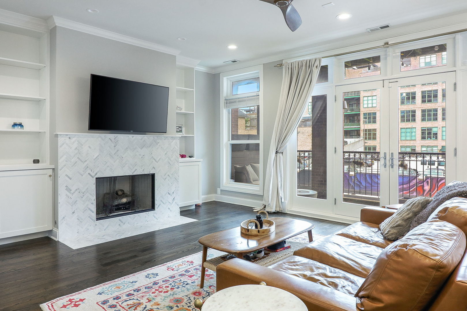 39 North Morgan Street, Unit 3 Chicago, IL 60607 - Photo 3 of 18 a living room with furniture fireplace and flat screen tv
