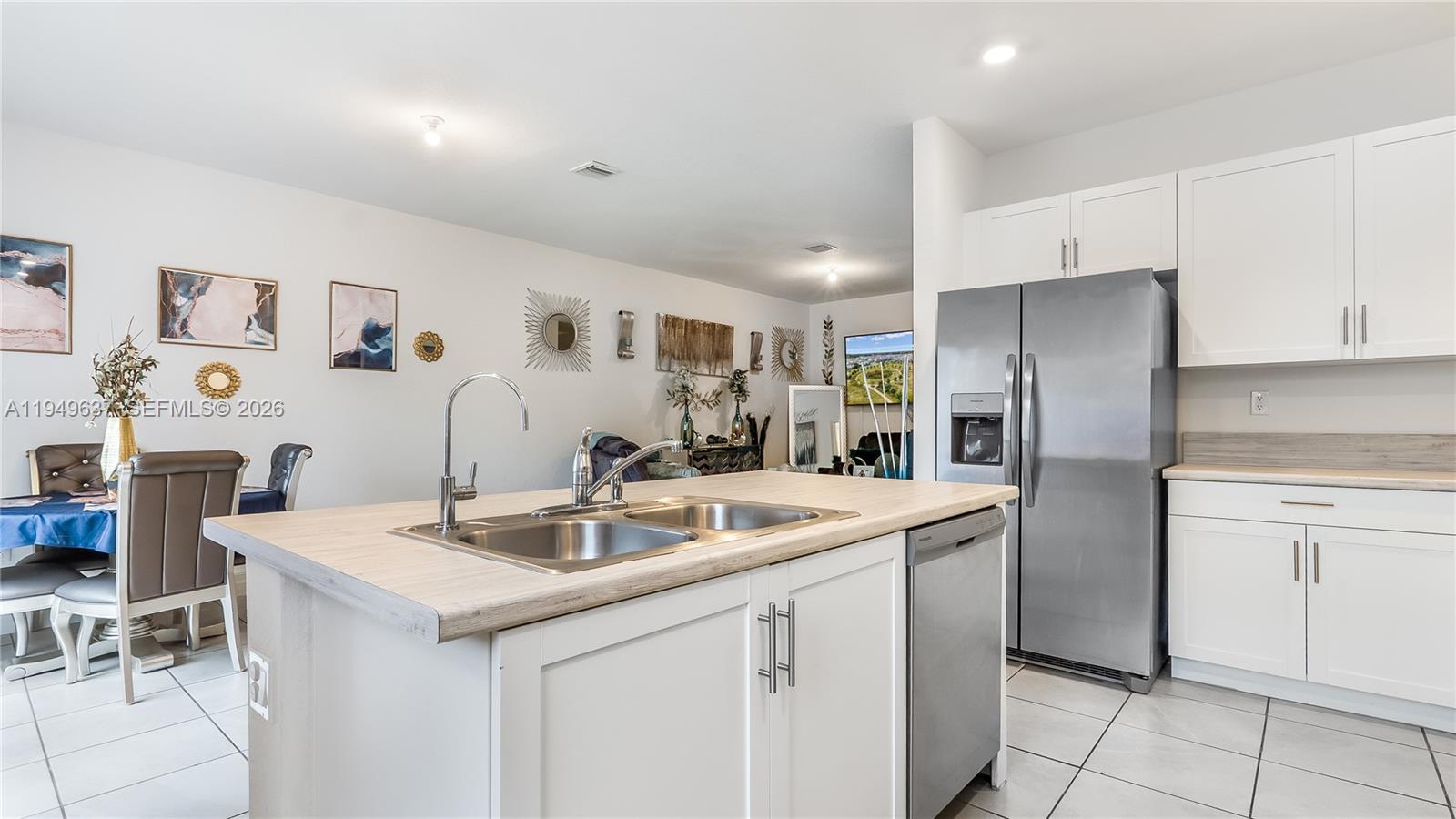 13410 Southwest 287th Terrace Homestead, FL 33033 - Photo 14 of 32 a kitchen with a sink and refrigerator