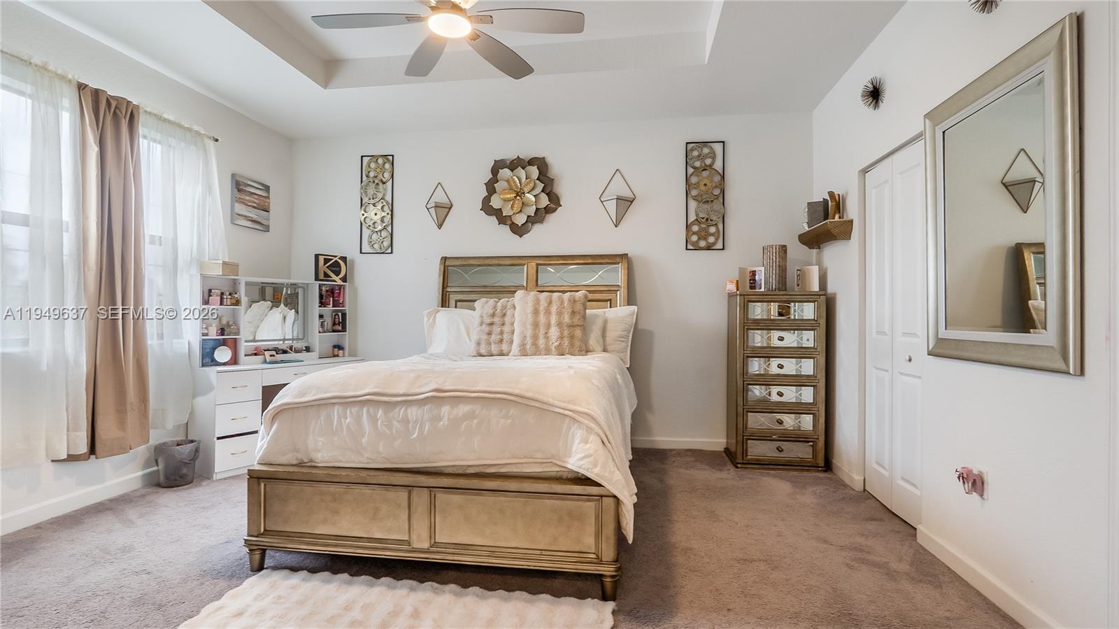 13410 Southwest 287th Terrace Homestead, FL 33033 - Photo 18 of 32 a bedroom with a bed and a chandelier