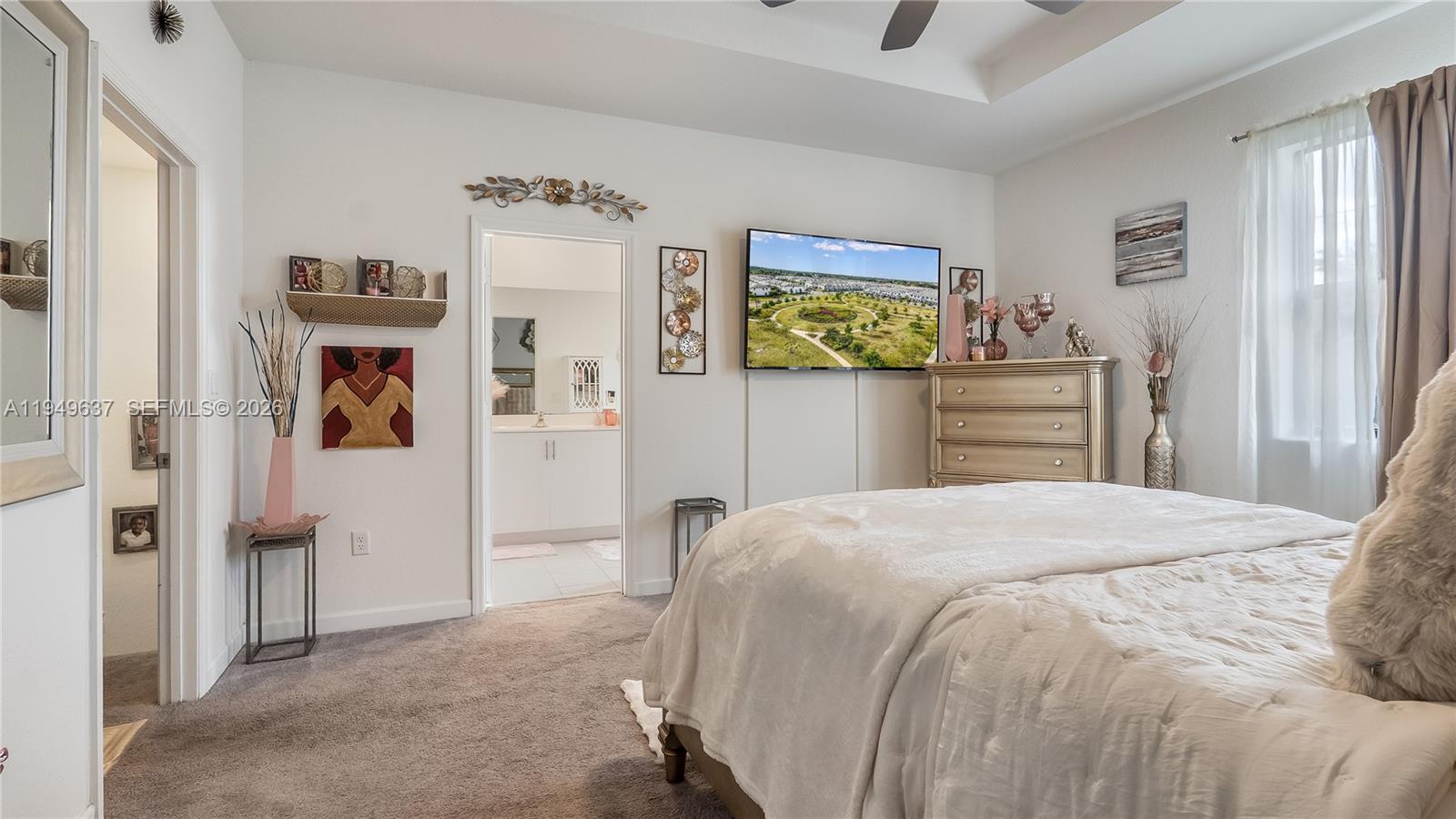 13410 Southwest 287th Terrace Homestead, FL 33033 - Photo 19 of 32 a bedroom with a bed and dresser