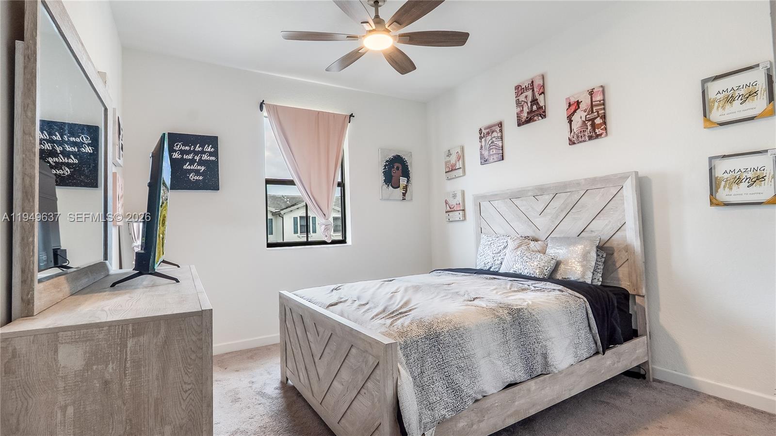 13410 Southwest 287th Terrace Homestead, FL 33033 - Photo 24 of 32 a bedroom with a bed and wall painting