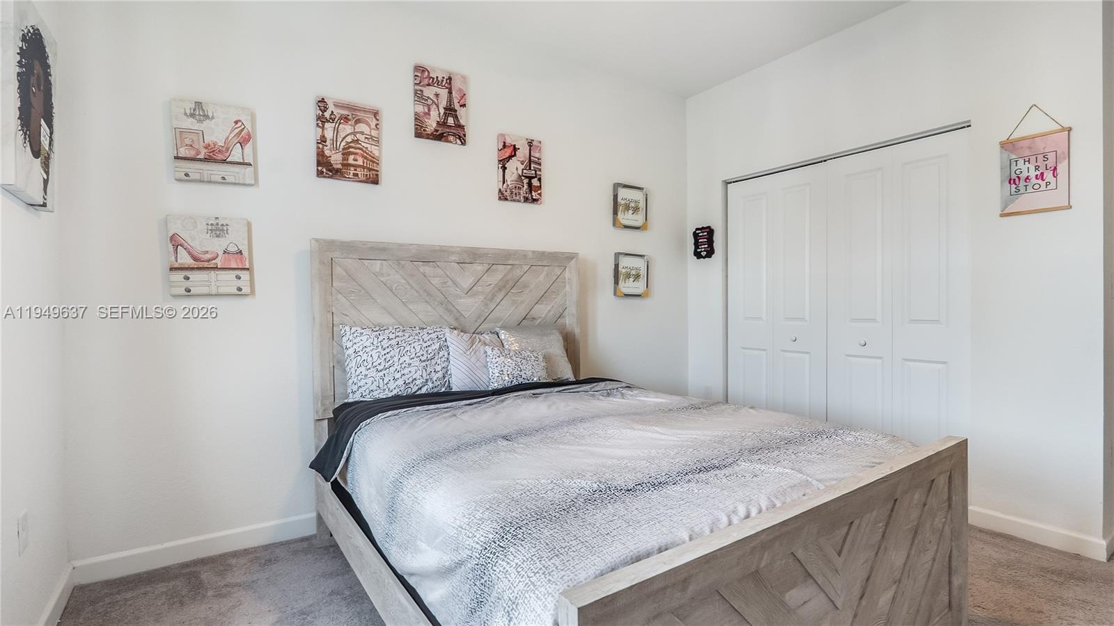 13410 Southwest 287th Terrace Homestead, FL 33033 - Photo 25 of 32 a bedroom with a bed and the wall painting