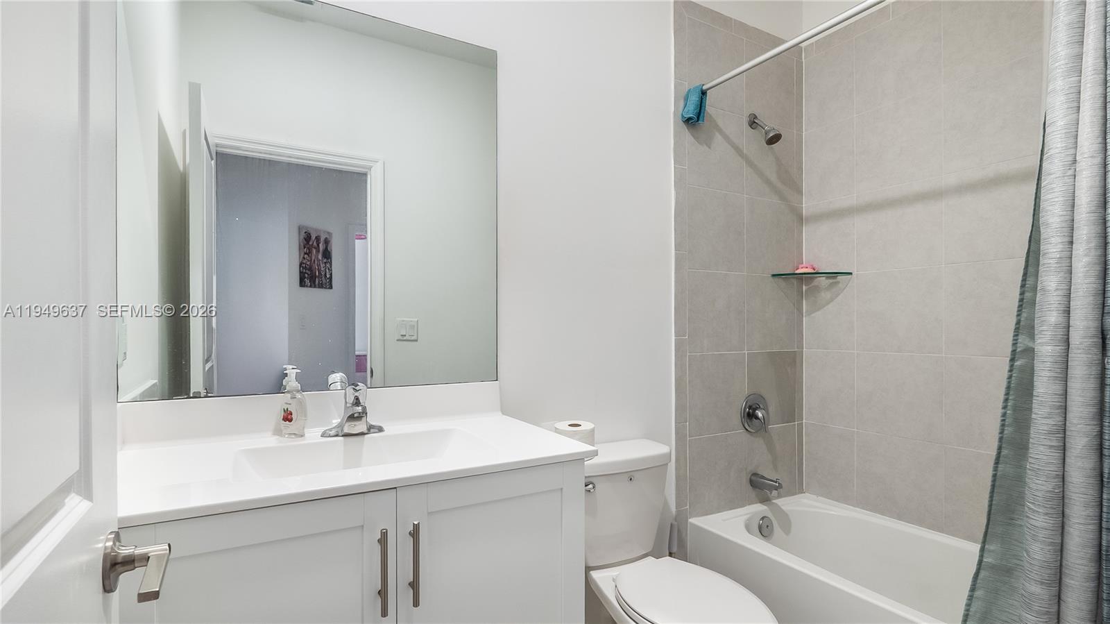 13410 Southwest 287th Terrace Homestead, FL 33033 - Photo 26 of 32 a bathroom with a sink toilet and shower