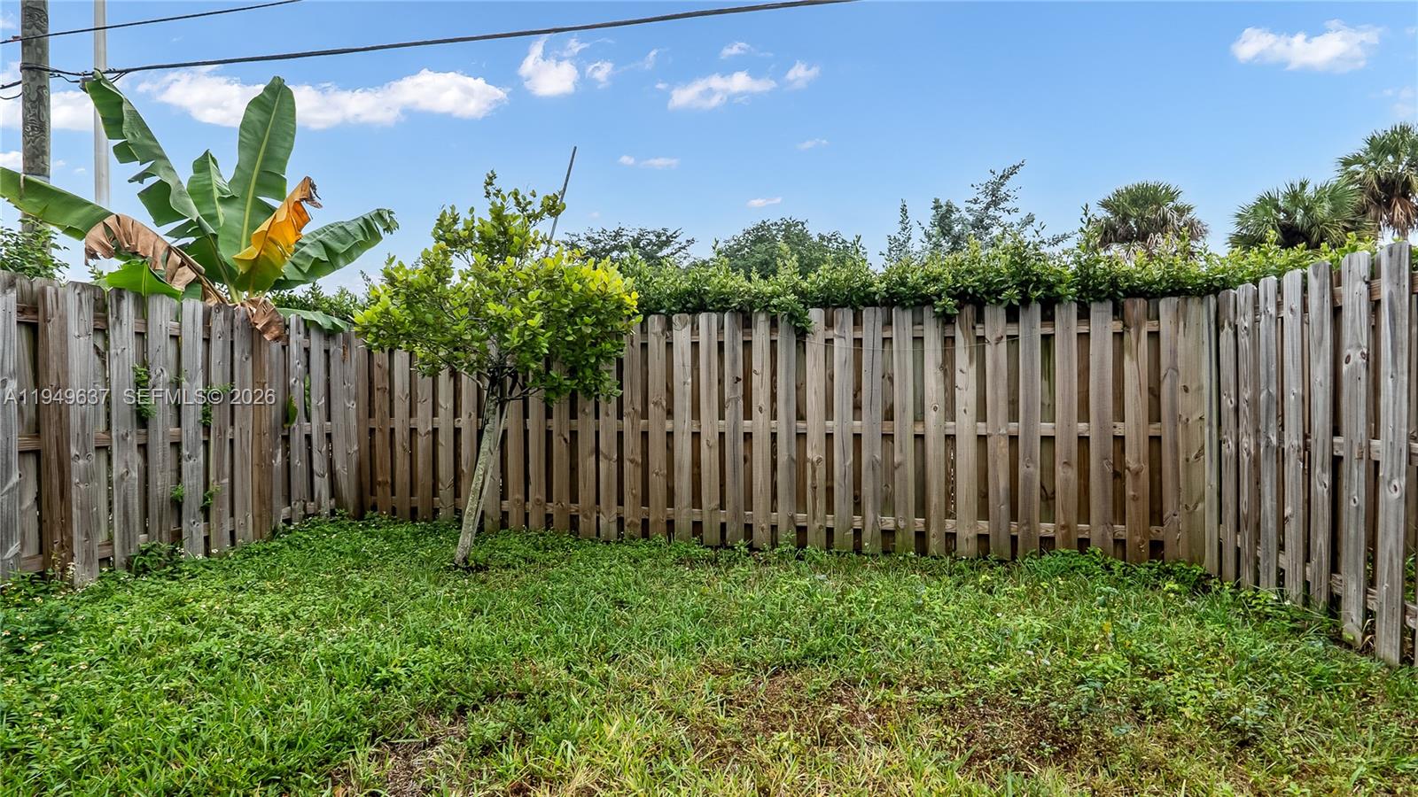 13410 Southwest 287th Terrace Homestead, FL 33033 - Photo 28 of 32 a view of small garden with wooden fence