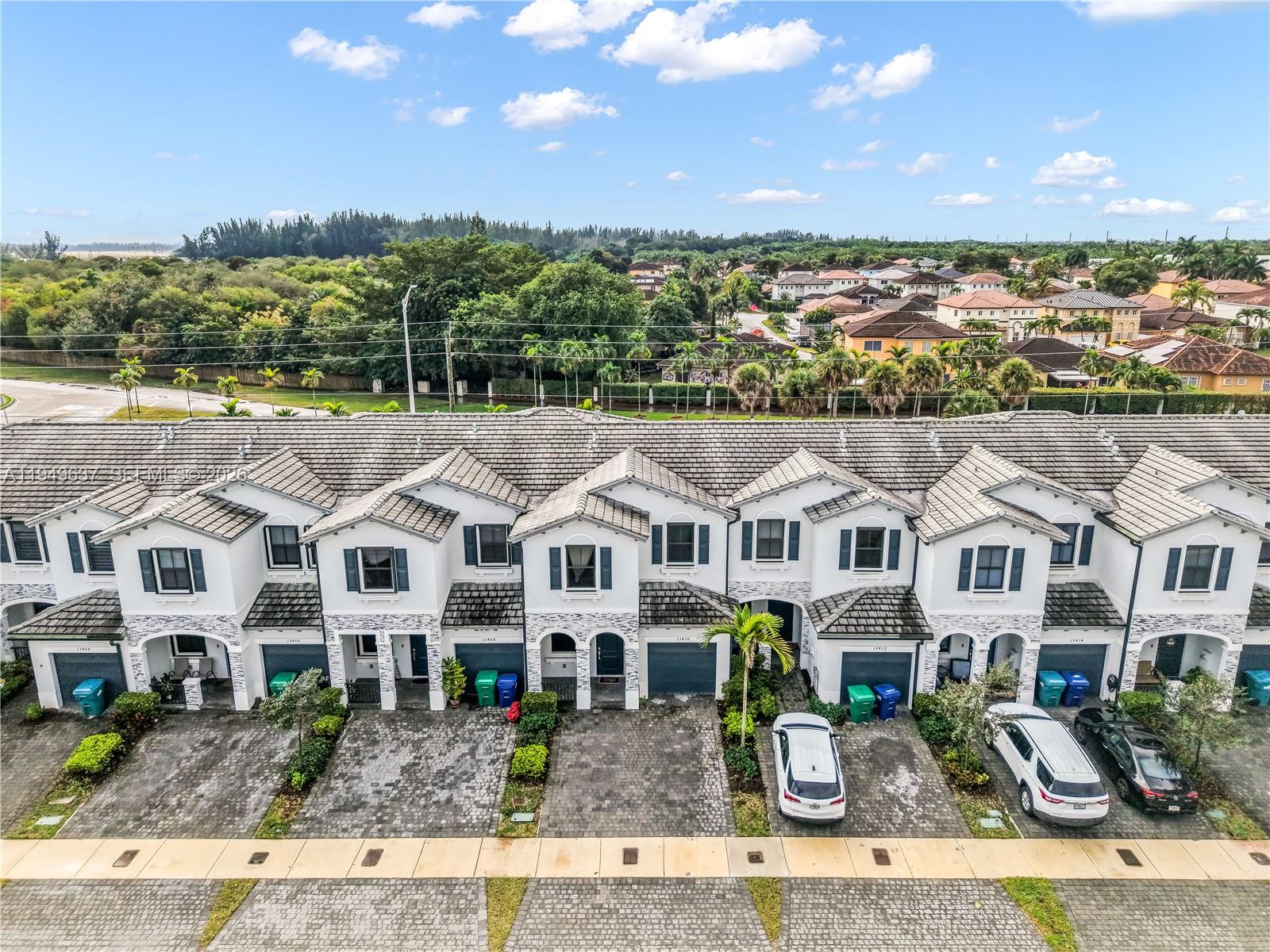 13410 Southwest 287th Terrace Homestead, FL 33033 - Photo 32 of 32 a front view of residential houses with yard