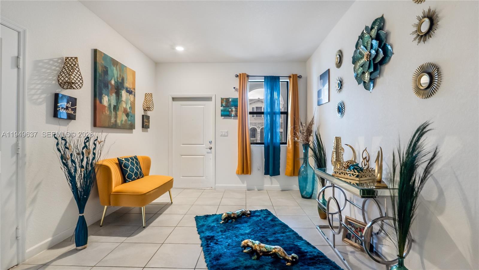 13410 Southwest 287th Terrace Homestead, FL 33033 - Photo 4 of 32 a living room with patio furniture and a wooden floor