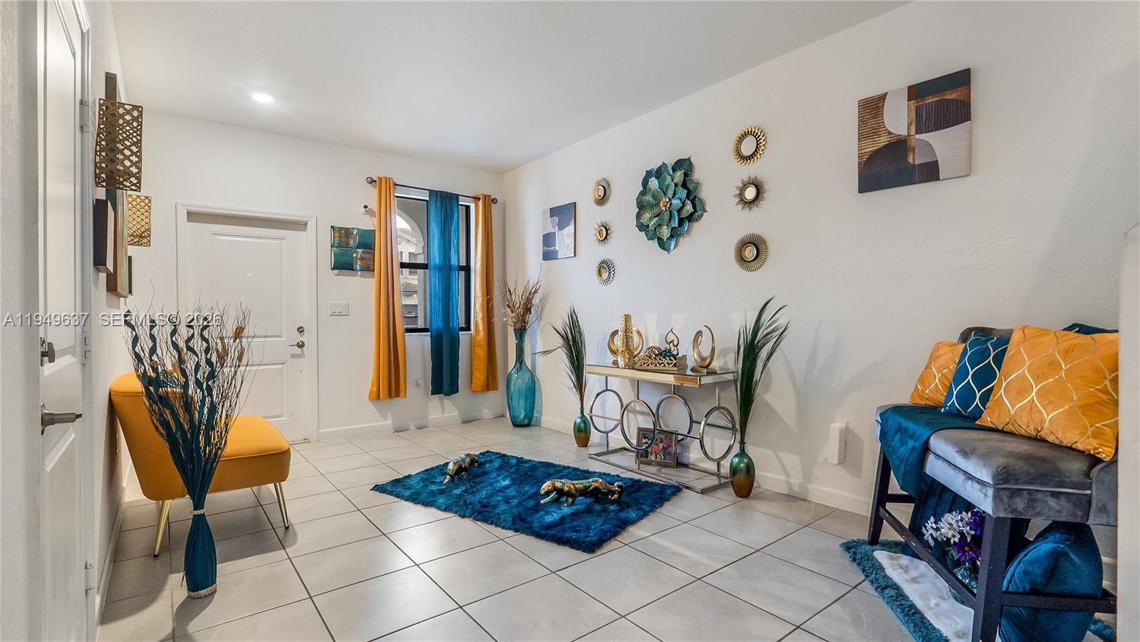 13410 Southwest 287th Terrace Homestead, FL 33033 - Photo 5 of 32 a living room with furniture and a rug