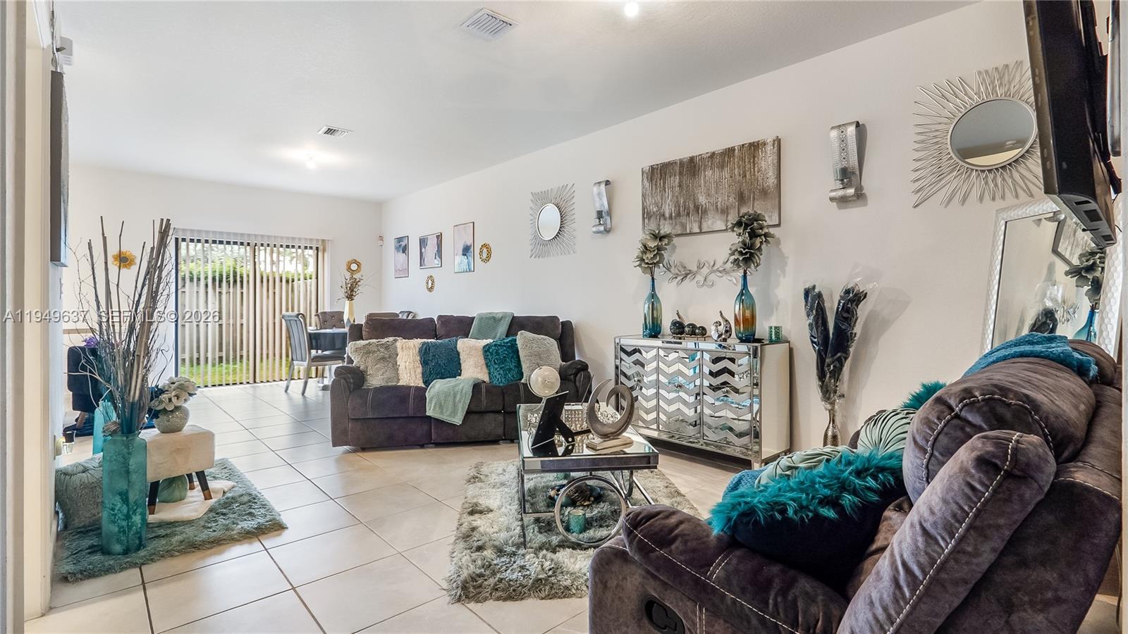13410 Southwest 287th Terrace Homestead, FL 33033 - Photo 7 of 32 a living room with furniture and a couch