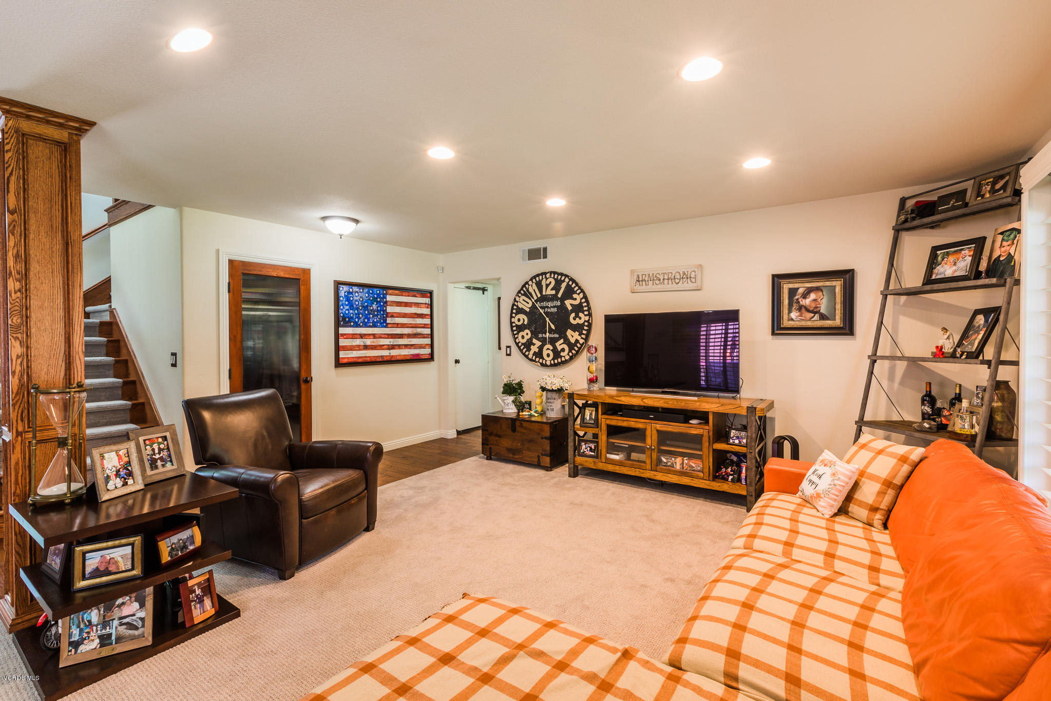 660 Appleton Road Simi Valley, CA 93065 - Photo 11 of 47 a living room with furniture gym equipment and a flat screen tv