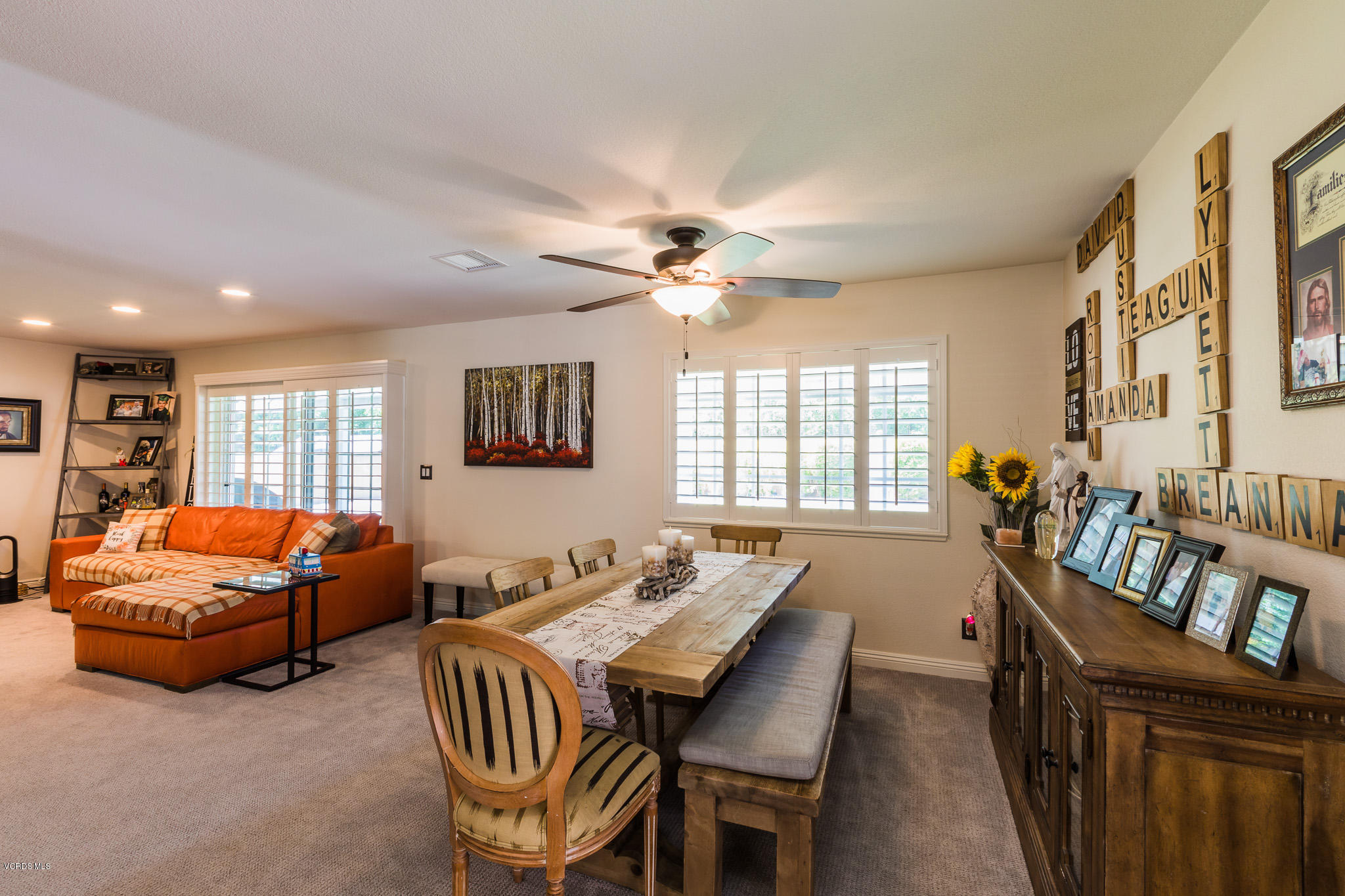 660 Appleton Road Simi Valley, CA 93065 - Photo 16 of 47 a living room with furniture a fireplace and a large window