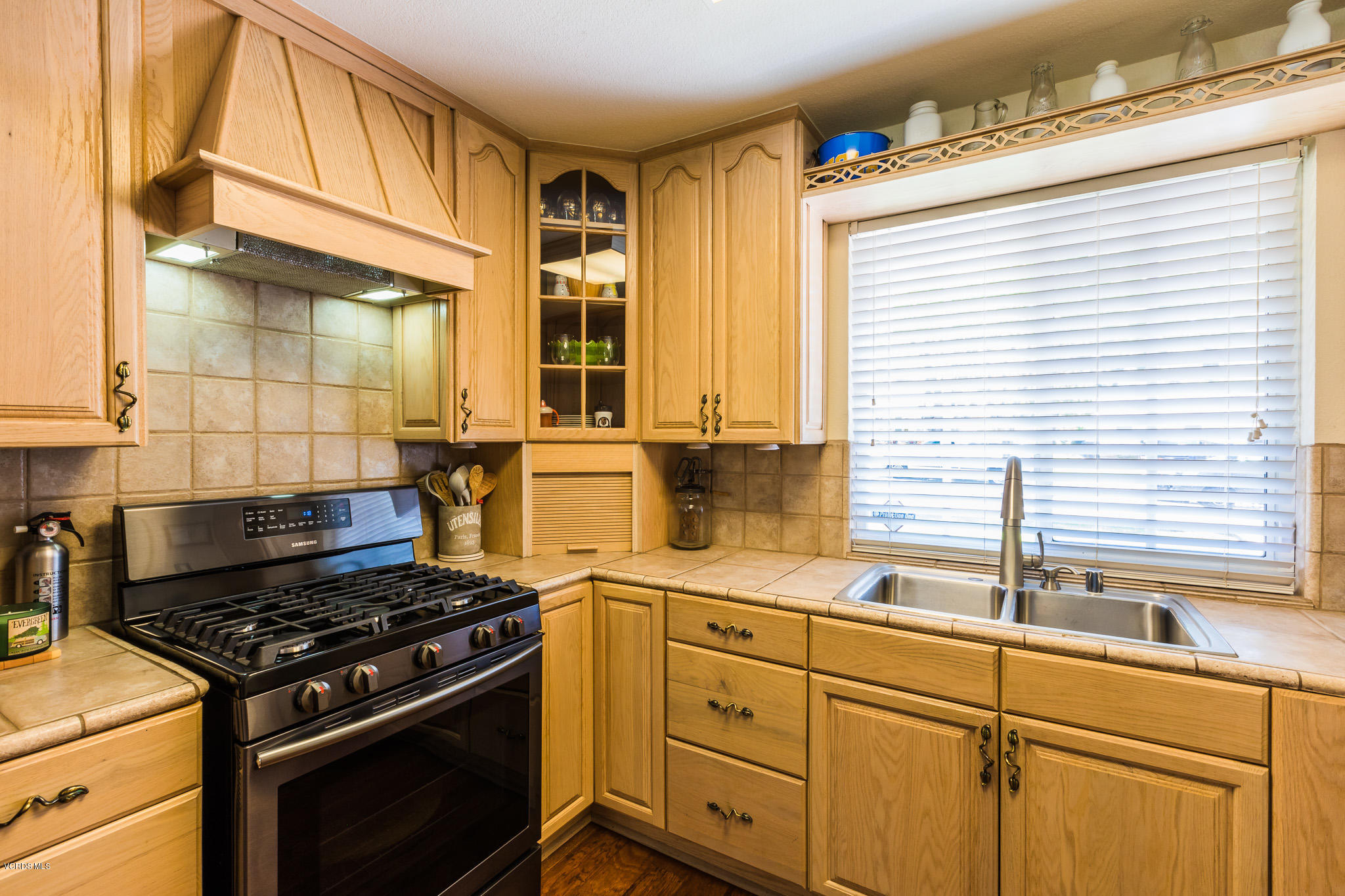 660 Appleton Road Simi Valley, CA 93065 - Photo 19 of 47 a kitchen with granite countertop cabinets stainless steel appliances and a window