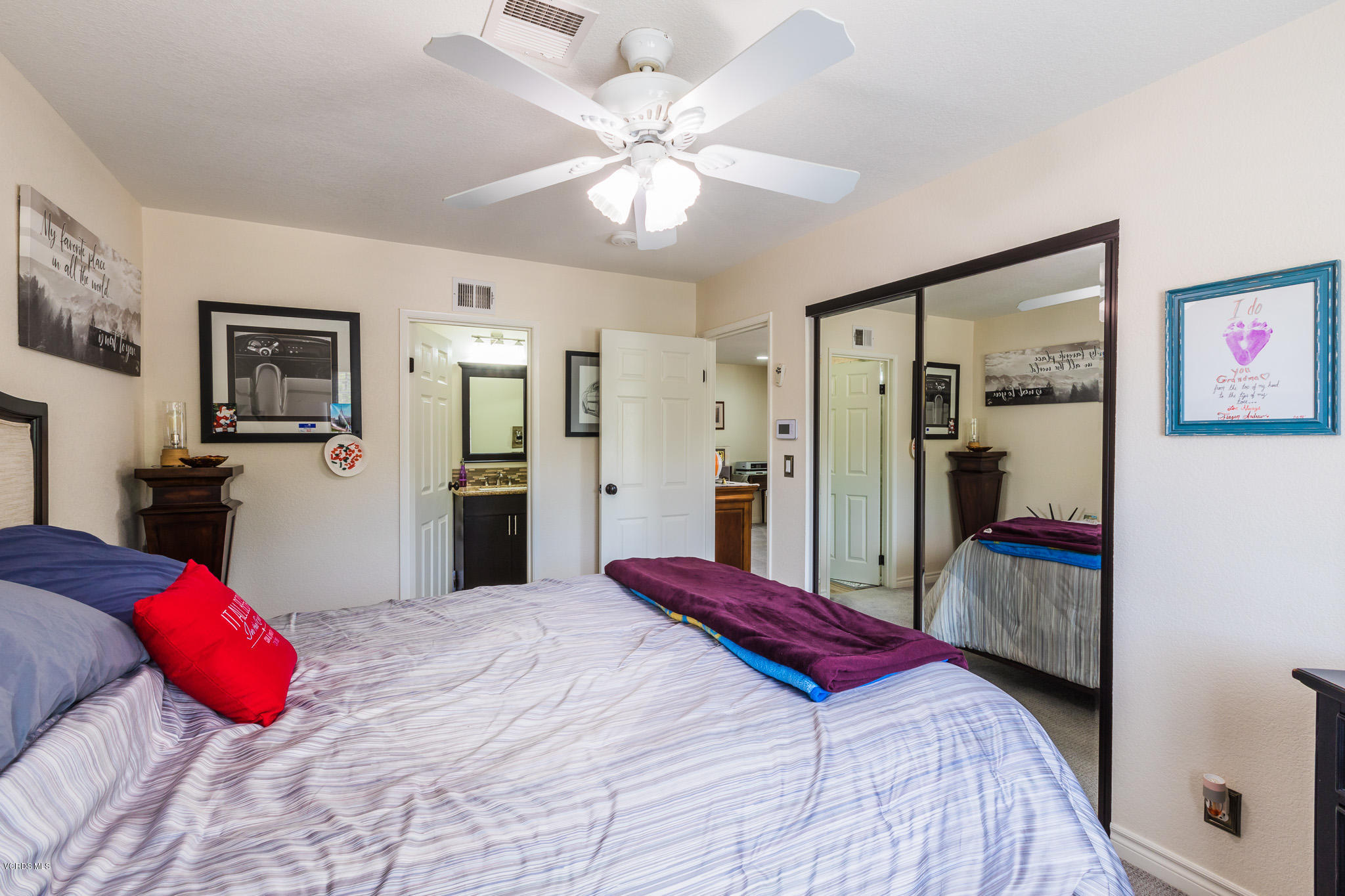 660 Appleton Road Simi Valley, CA 93065 - Photo 31 of 47 a bedroom with a large bed and a chandelier