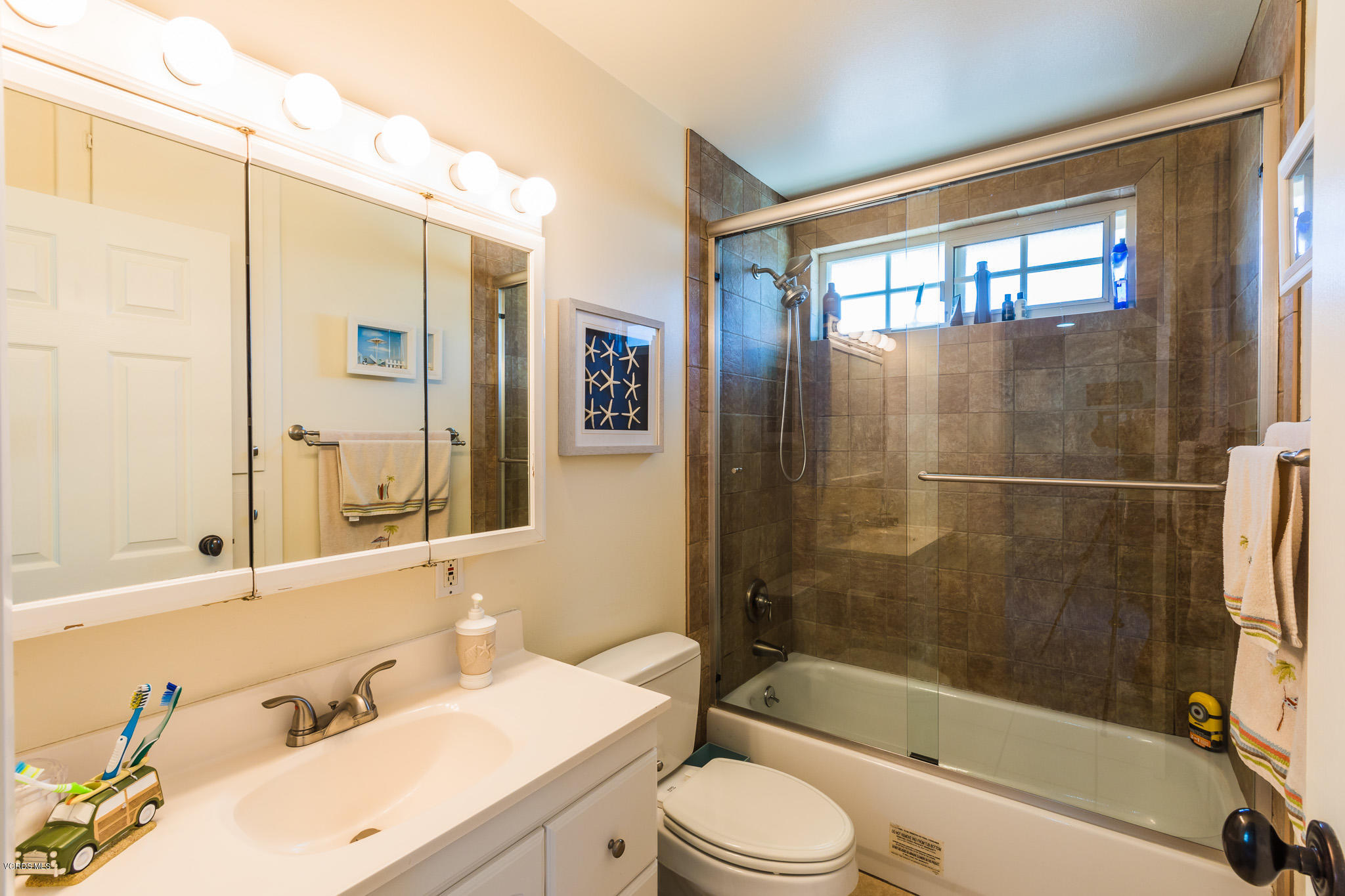 660 Appleton Road Simi Valley, CA 93065 - Photo 34 of 47 a bathroom with a bathtub shower sink mirror vanity and toilet