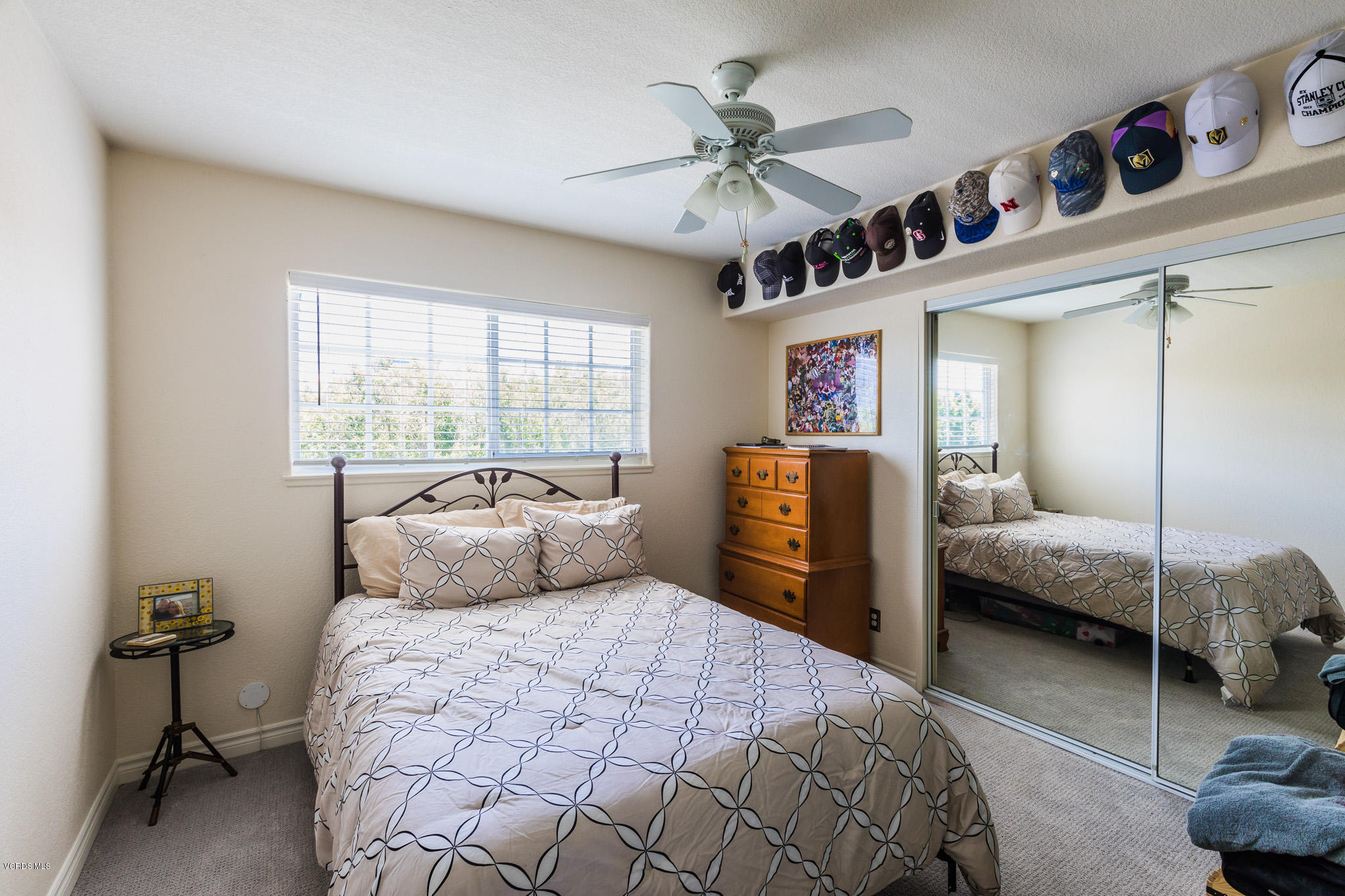 660 Appleton Road Simi Valley, CA 93065 - Photo 36 of 47 a bedroom with a large bed and a chandelier