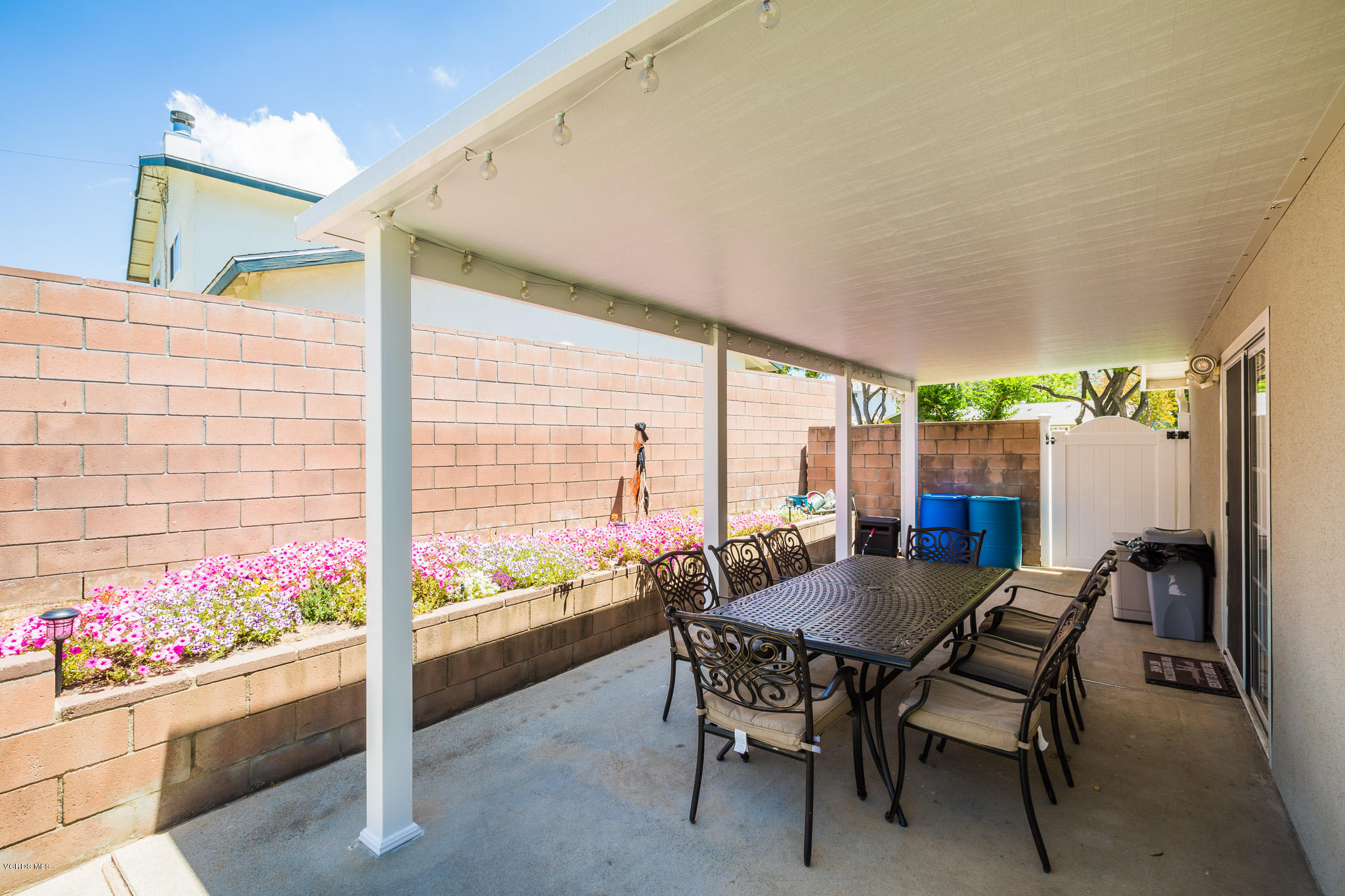 660 Appleton Road Simi Valley, CA 93065 - Photo 46 of 47 a view of a patio with a table and chairs and potted plants