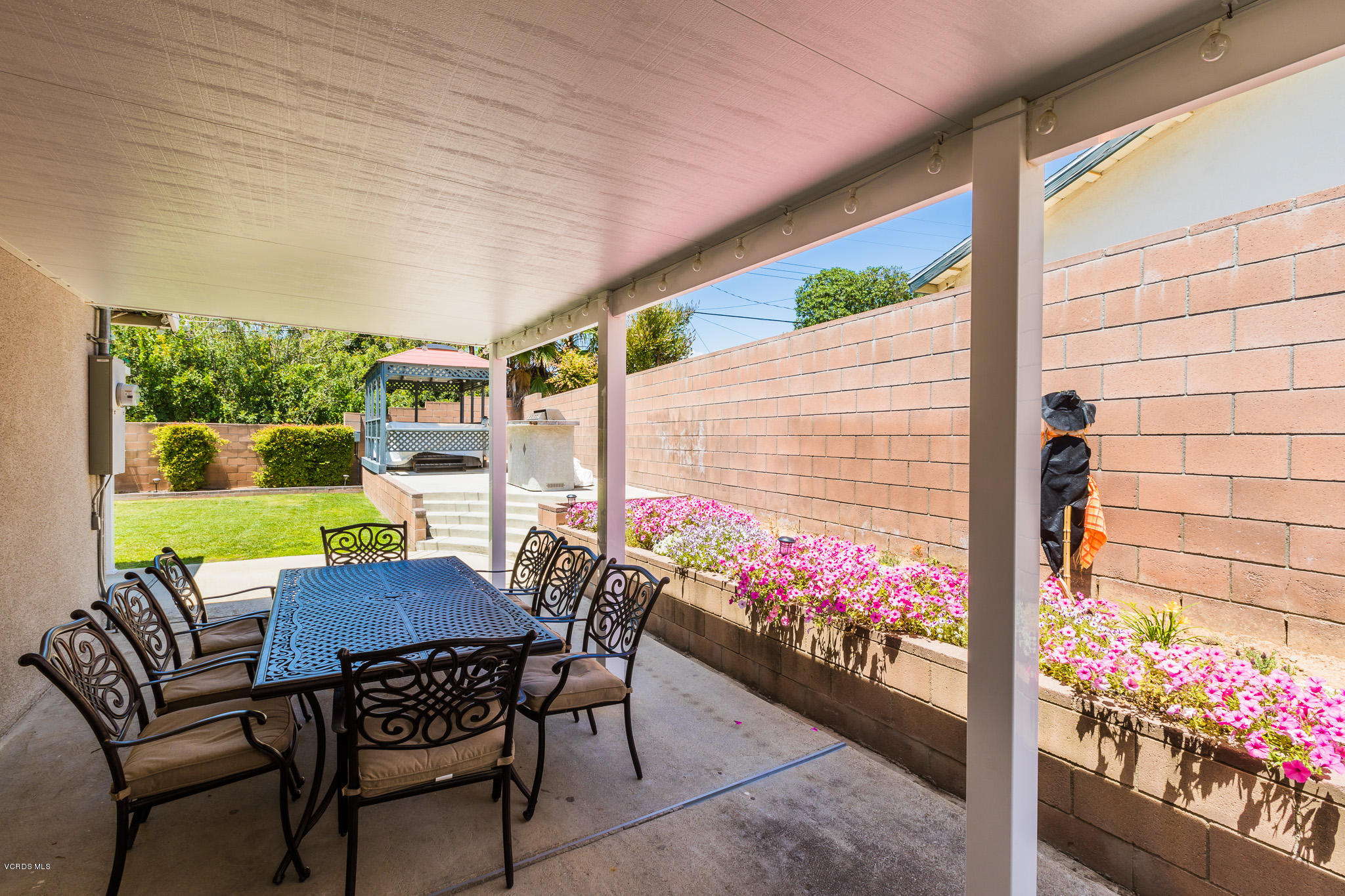 660 Appleton Road Simi Valley, CA 93065 - Photo 47 of 47 a view of a patio with a table and chairs and potted plants