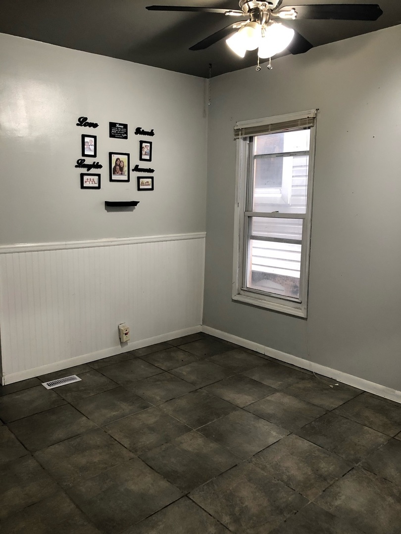 1834 South Racine Avenue Chicago, IL 60608 - Photo 13 of 36 a view of a livingroom with window and hardwood floor