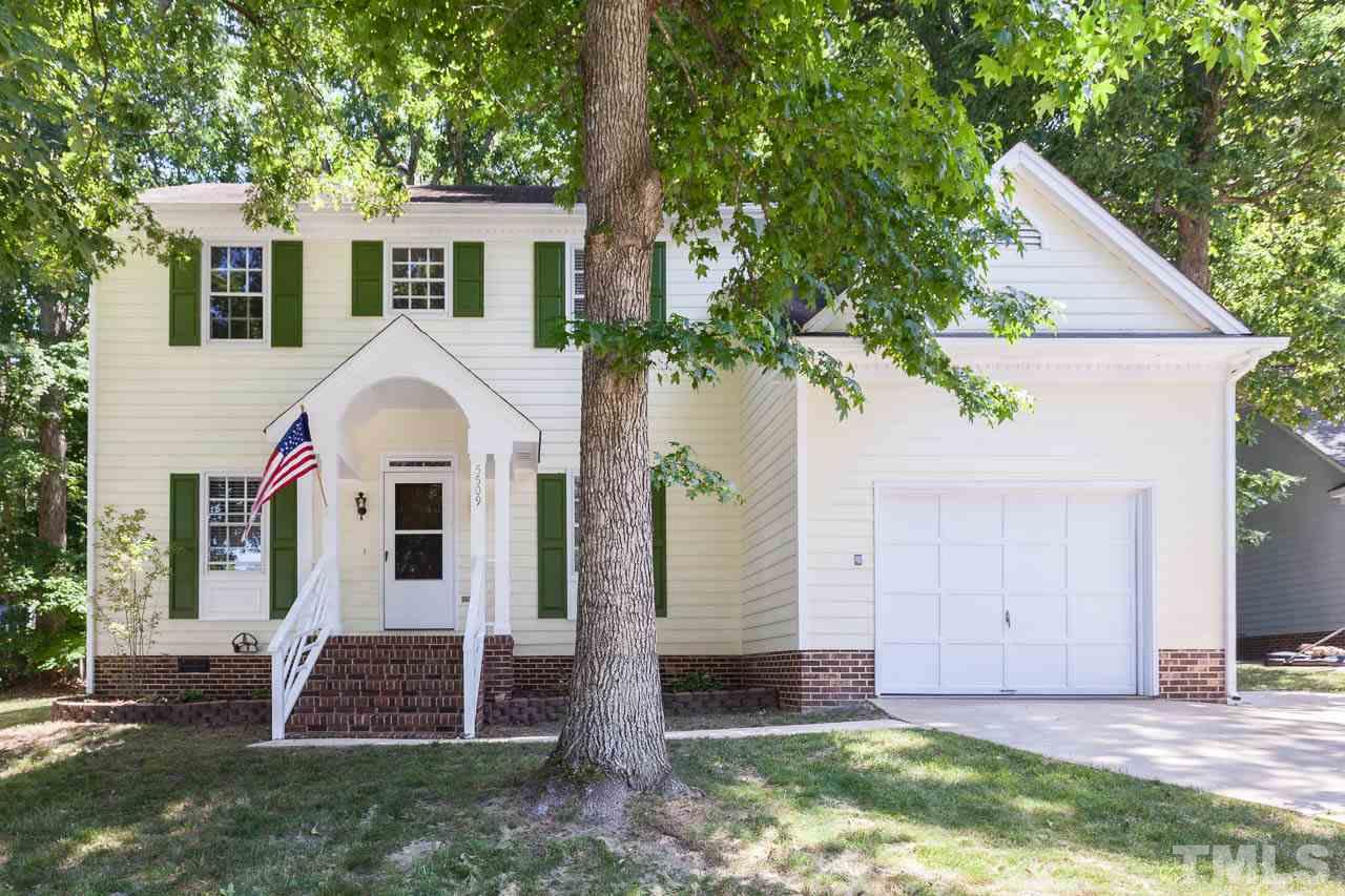 5509 Banwell Place Raleigh, NC 27613 - Photo 2 of 17 a view of house with garden