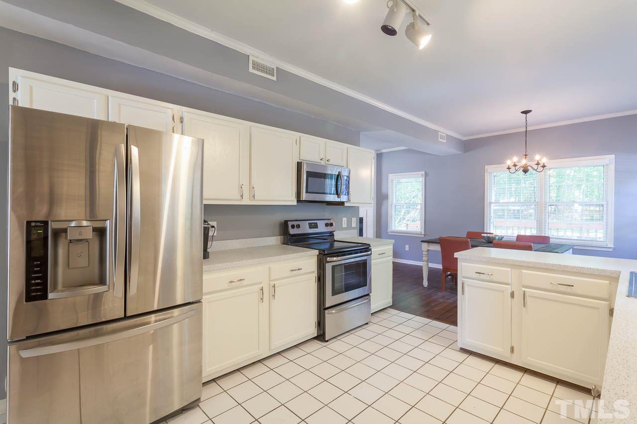 5509 Banwell Place Raleigh, NC 27613 - Photo 12 of 17 a kitchen with a refrigerator stove and sink