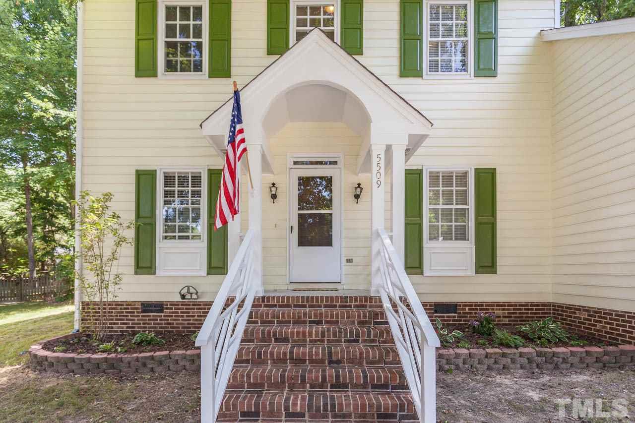 5509 Banwell Place Raleigh, NC 27613 - Photo 3 of 17 a front view of a house with a yard