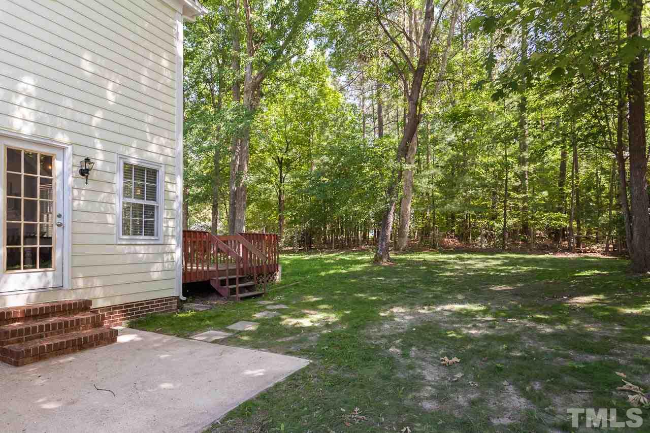 5509 Banwell Place Raleigh, NC 27613 - Photo 4 of 17 a view of a backyard with a garden