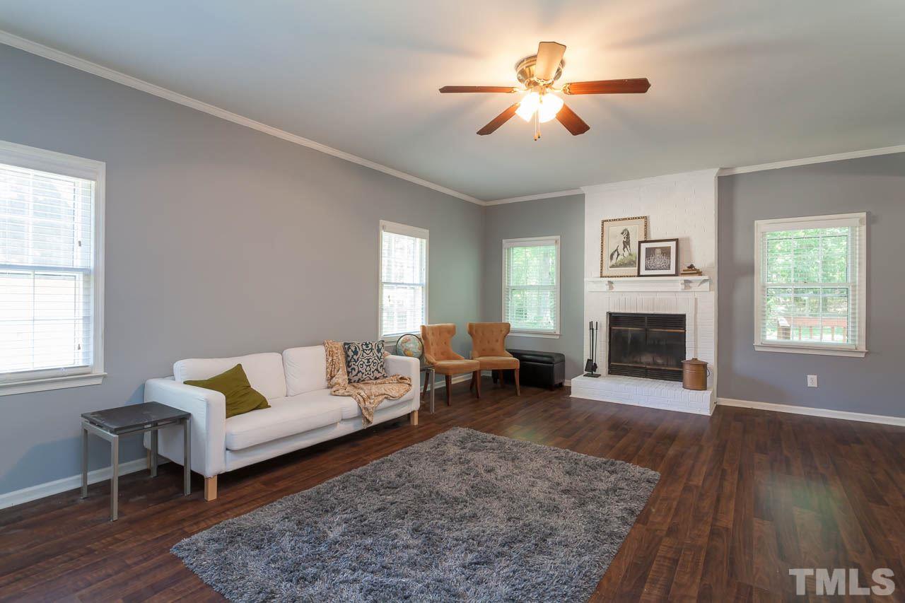 5509 Banwell Place Raleigh, NC 27613 - Photo 8 of 17 a living room with furniture and a fireplace