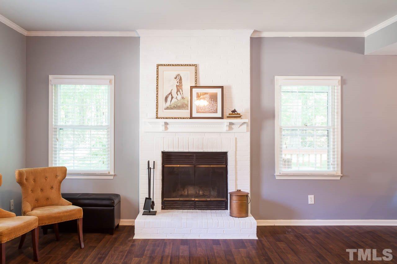 5509 Banwell Place Raleigh, NC 27613 - Photo 9 of 17 a living room with furniture and a fireplace