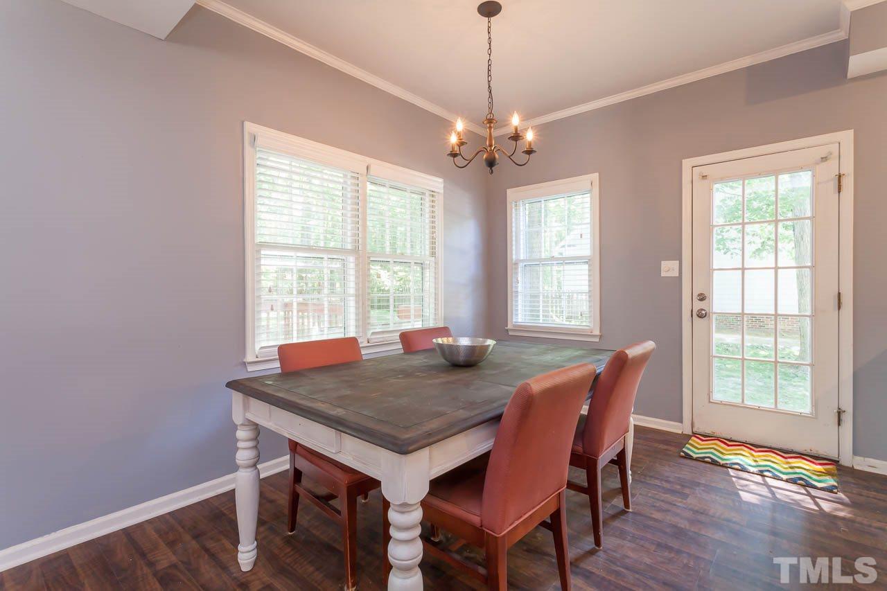 5509 Banwell Place Raleigh, NC 27613 - Photo 10 of 17 a view of a dining room with furniture window and wooden floor