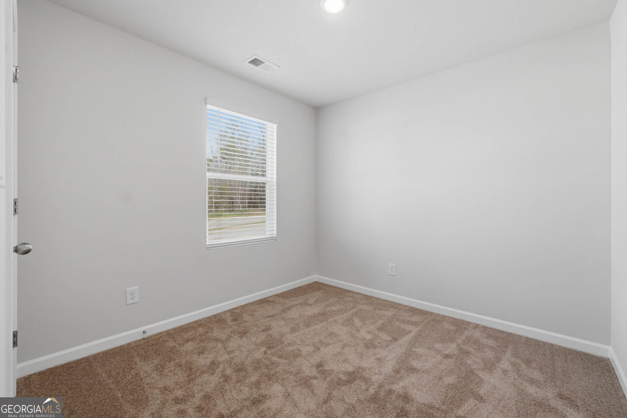 5284 Magnolia Grove Way Gainesville, GA 30504 - Photo 13 of 31 an empty room with a window
