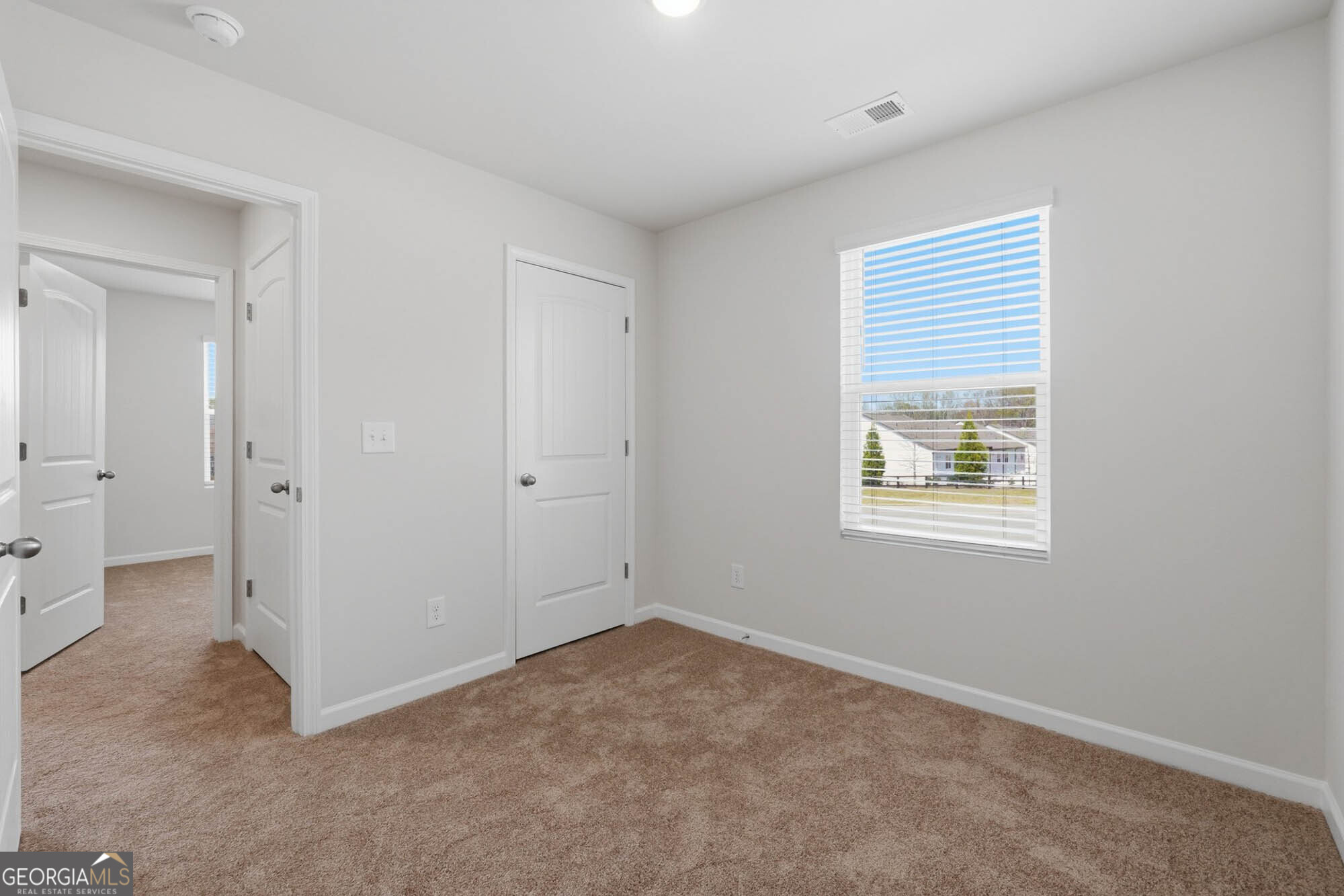 5284 Magnolia Grove Way Gainesville, GA 30504 - Photo 14 of 31 an empty room with windows