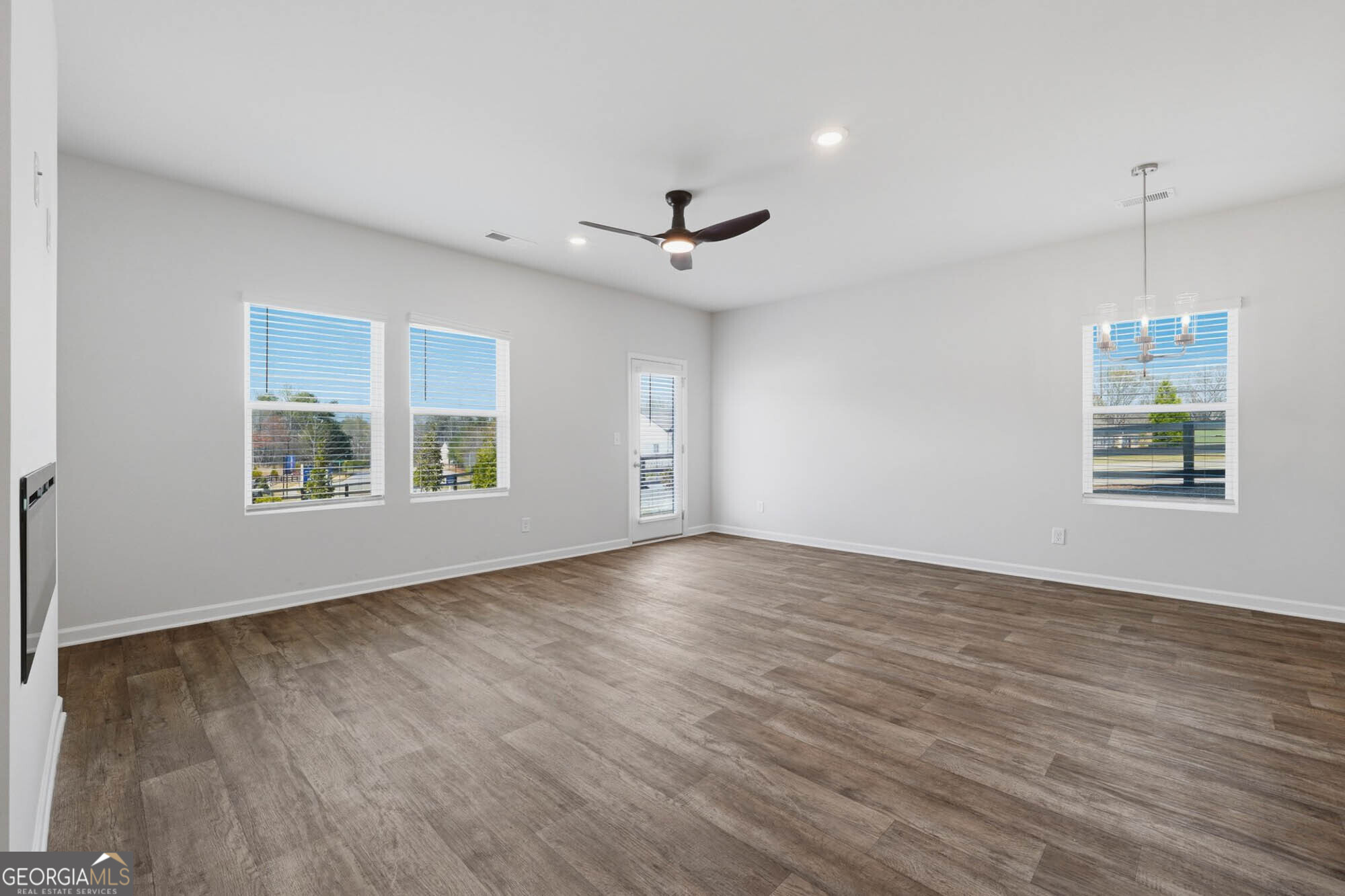 5284 Magnolia Grove Way Gainesville, GA 30504 - Photo 2 of 31 wooden floor in an empty room with a window