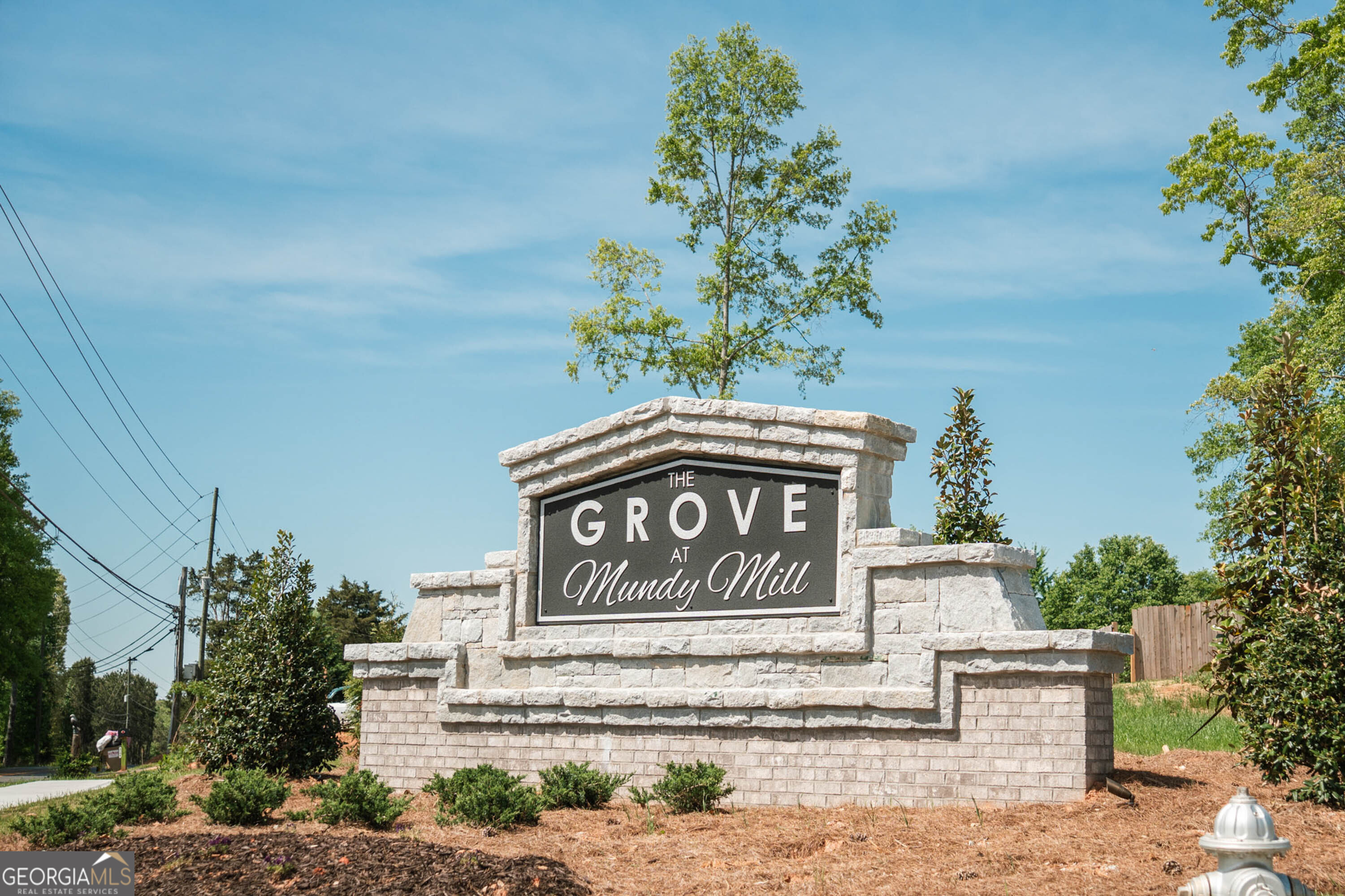5284 Magnolia Grove Way Gainesville, GA 30504 - Photo 24 of 31 a sign that is on the side of a building