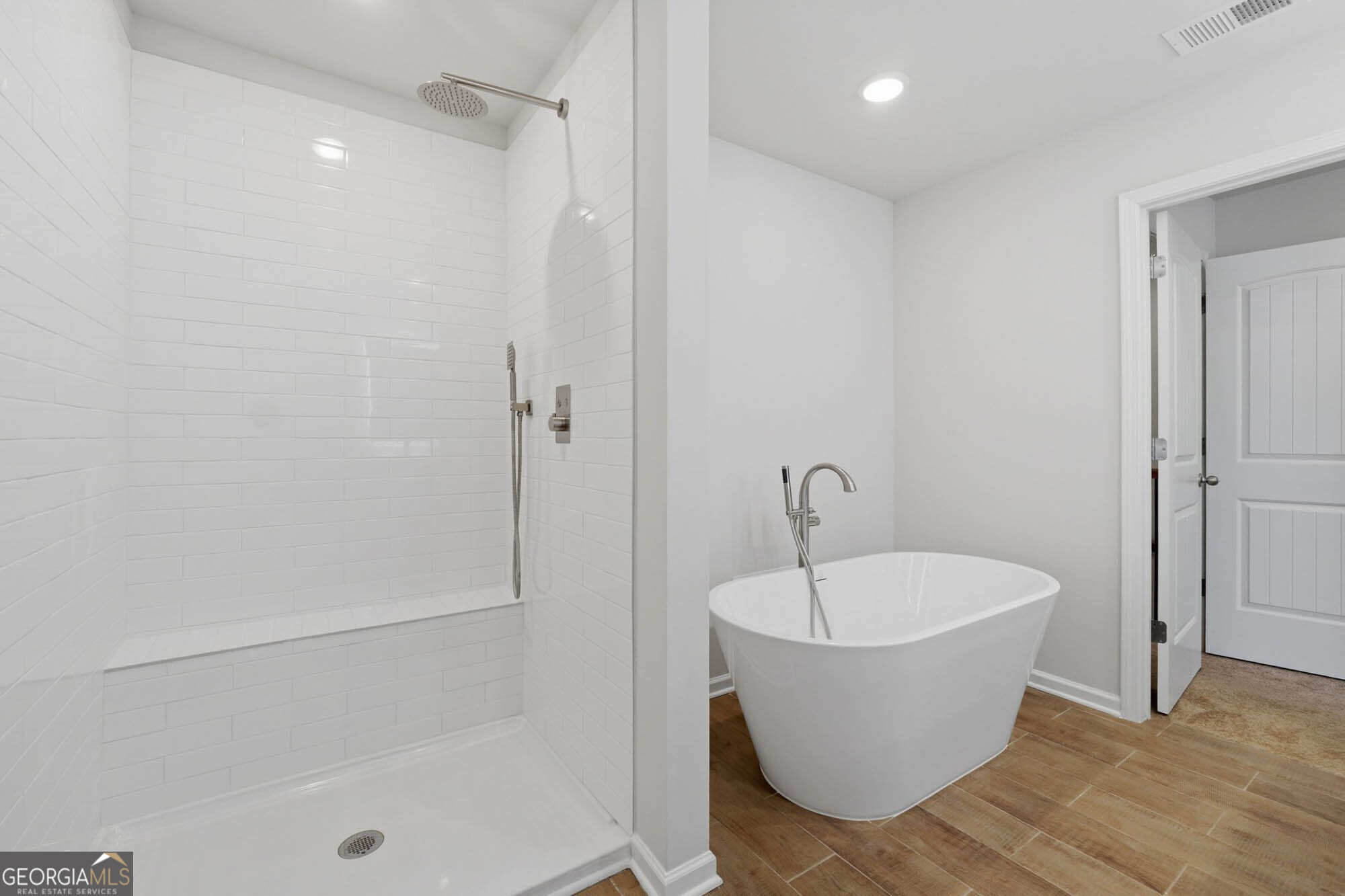 5284 Magnolia Grove Way Gainesville, GA 30504 - Photo 6 of 31 a bathroom with a bathtub and shower
