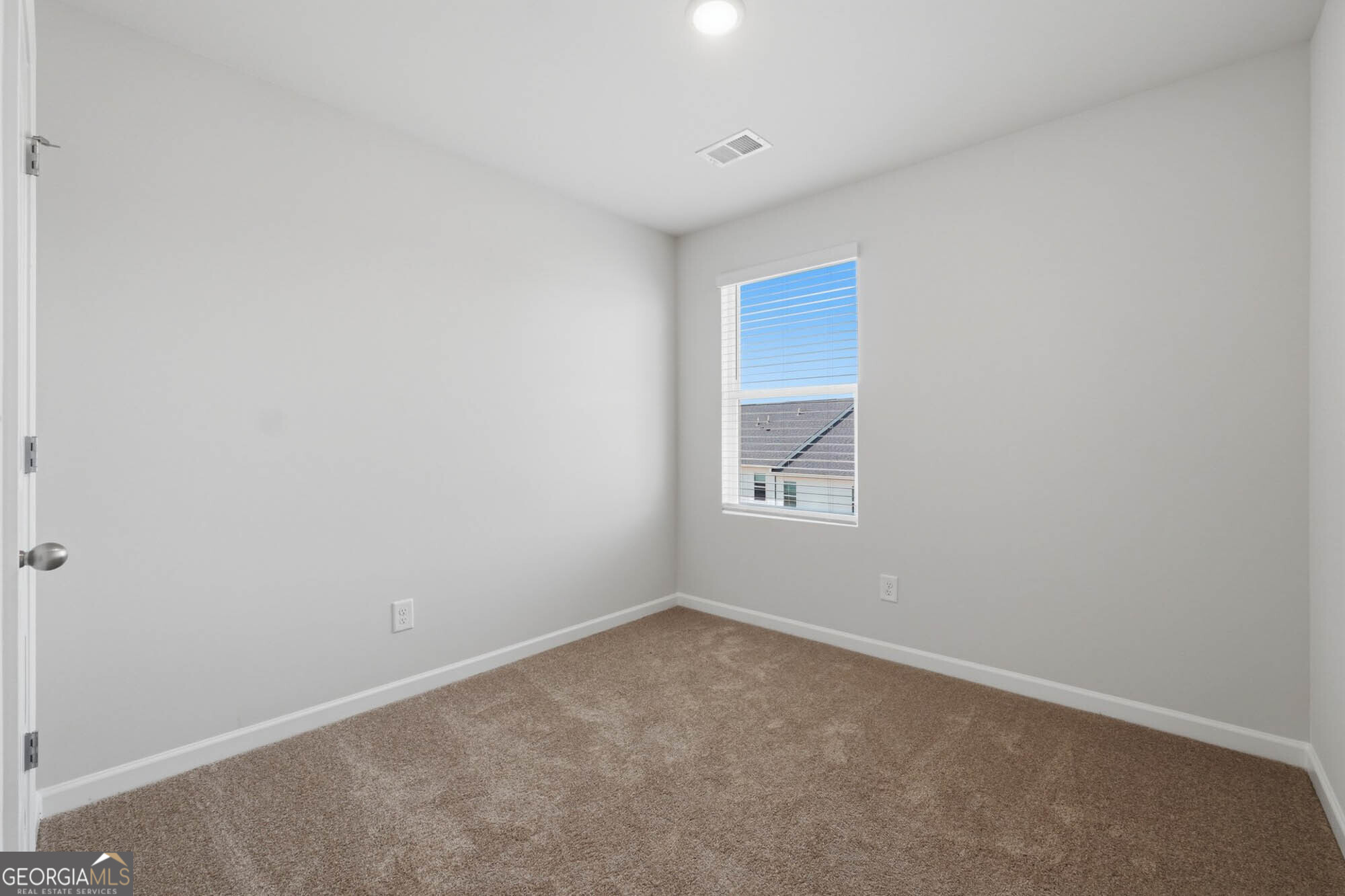 5284 Magnolia Grove Way Gainesville, GA 30504 - Photo 10 of 31 an empty room with a window
