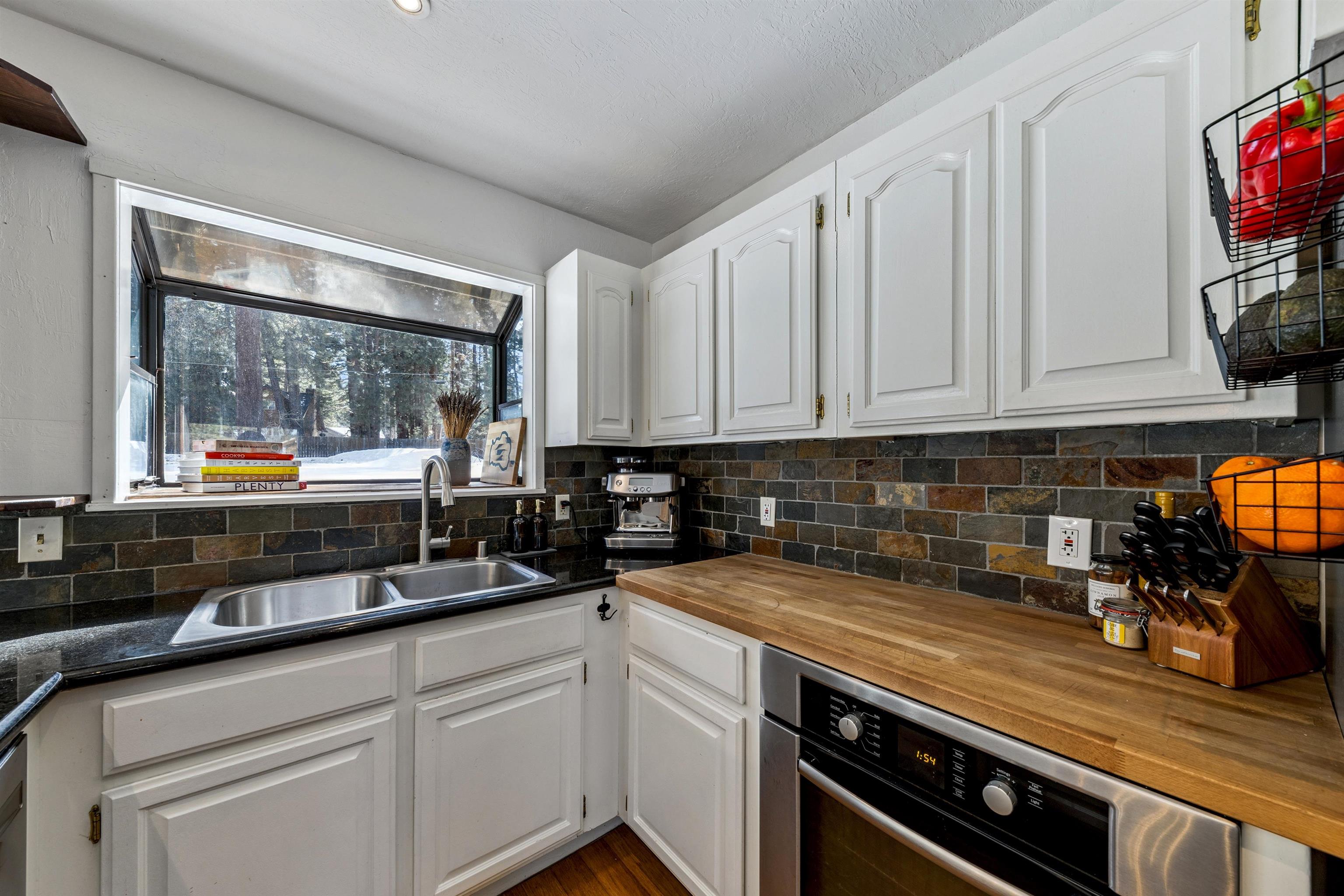 10895 Jeffery Pine Road Truckee, CA 96161 - Photo 17 of 25 a kitchen with a sink and cabinets