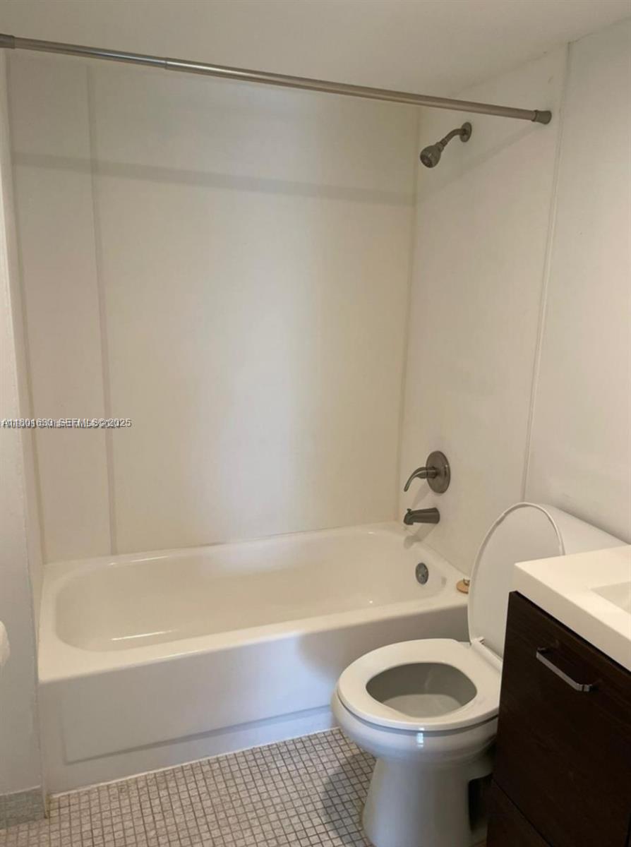 4164 Inverrary Drive, Unit 301 Lauderhill, FL 33319 - Photo 14 of 19 a bathroom with a sink a toilet and a bathtub