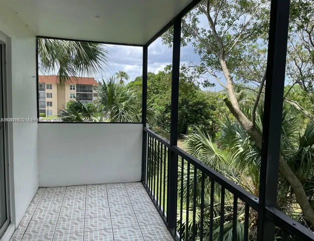 a view of a balcony with plants