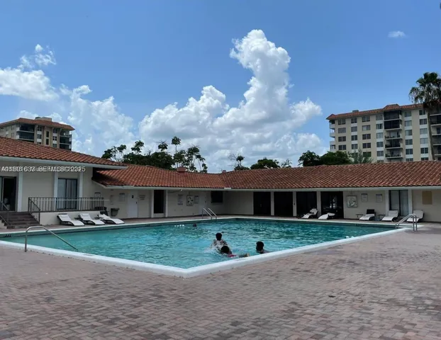 a front view of house with a garden and patio