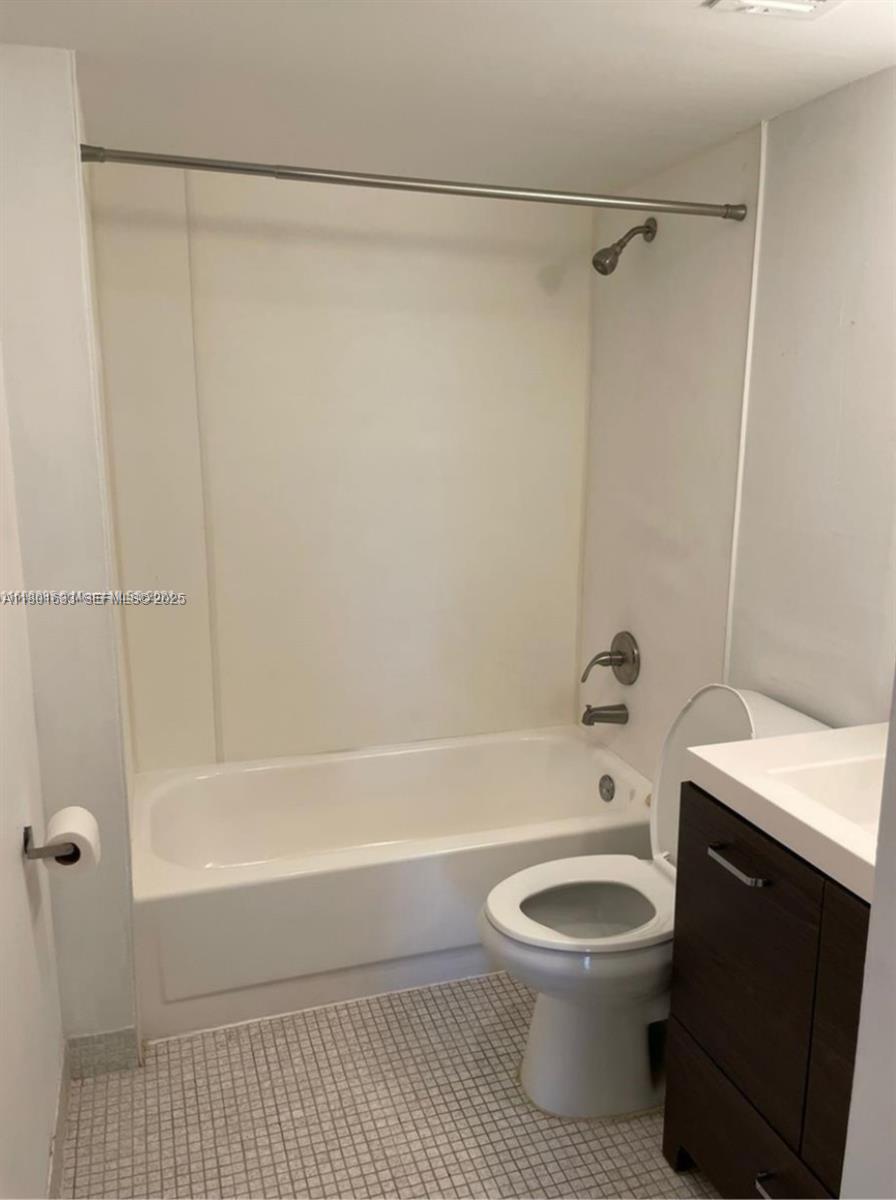 4164 Inverrary Drive, Unit 301 Lauderhill, FL 33319 - Photo 10 of 19 a bathroom with a toilet and a bathtub