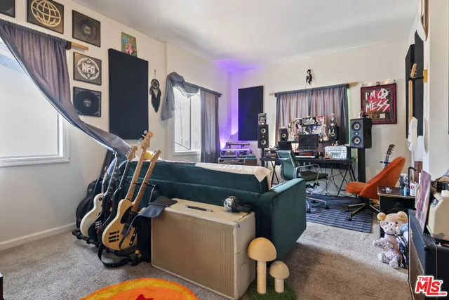 a room with furniture and a flat screen tv