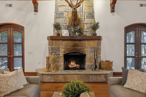 a view of a patio with table and chairs and potted plants